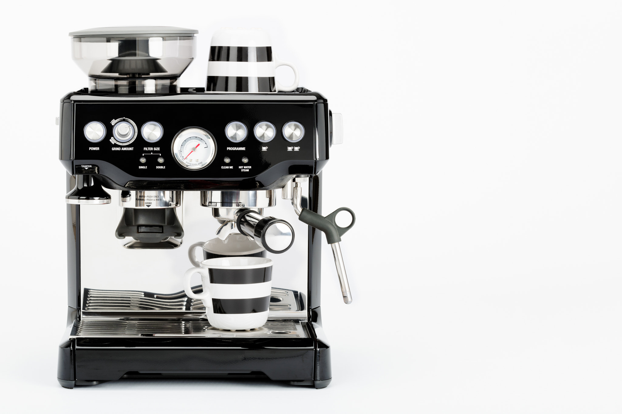 Nikon D810 sample photo. Isolated black manual coffee maker with grinder and coffee mugs on a white background, front view photography