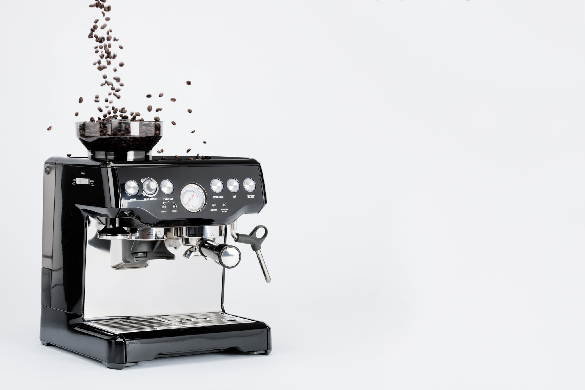 Nikon D810 sample photo. Isolated black manual coffee maker with grinder and falling coffee beans on white background,... photography