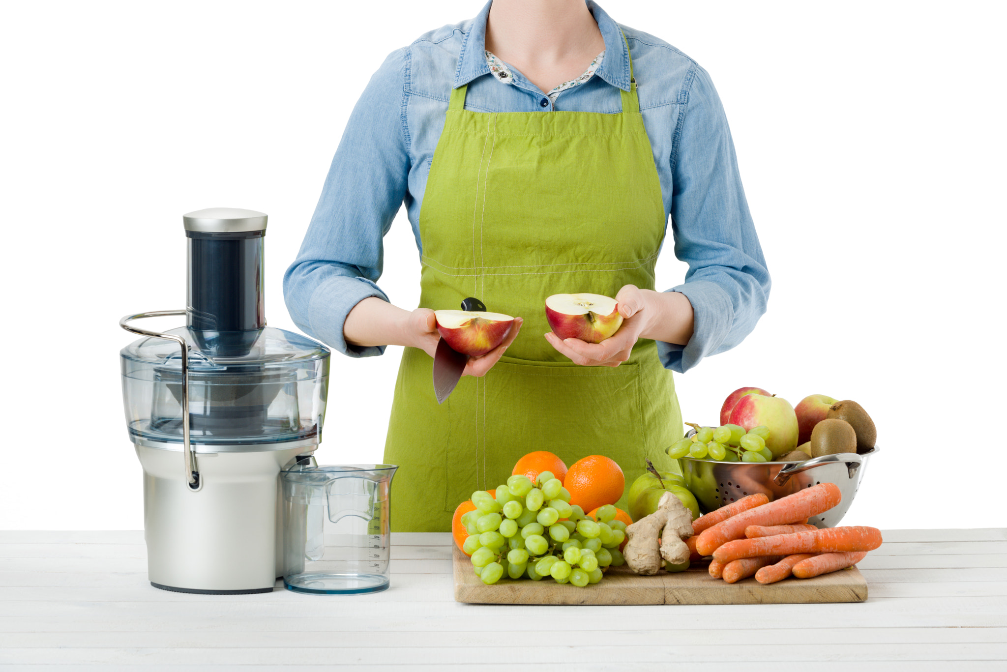 Nikon D810 sample photo. Anonymous woman wearing an apron, preparing fresh fruit juice using modern electric juicer,... photography