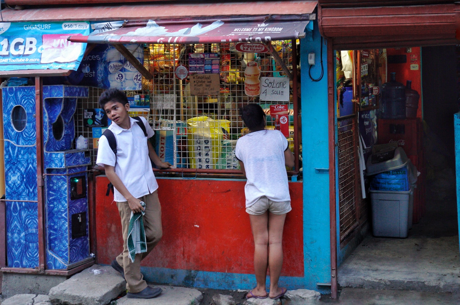 Sony a6300 + Sony E 18-50mm F4-5.6 sample photo. Technicolor neighbourhood shop photography