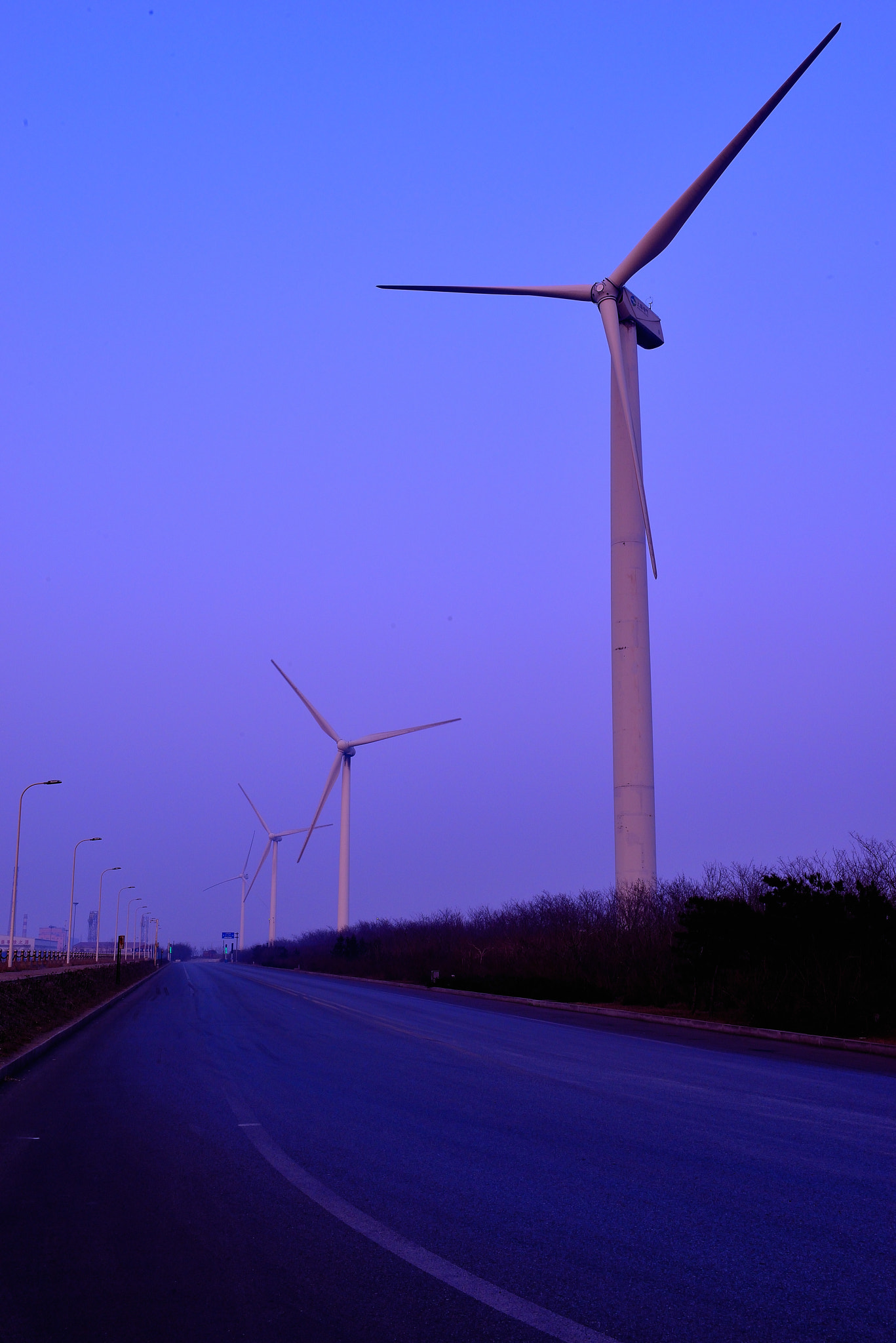 Nikon AF-S Nikkor 24-70mm F2.8G ED sample photo. Windmill in china, which provides power supply for a steel plant. clean enery by the seaside. photography