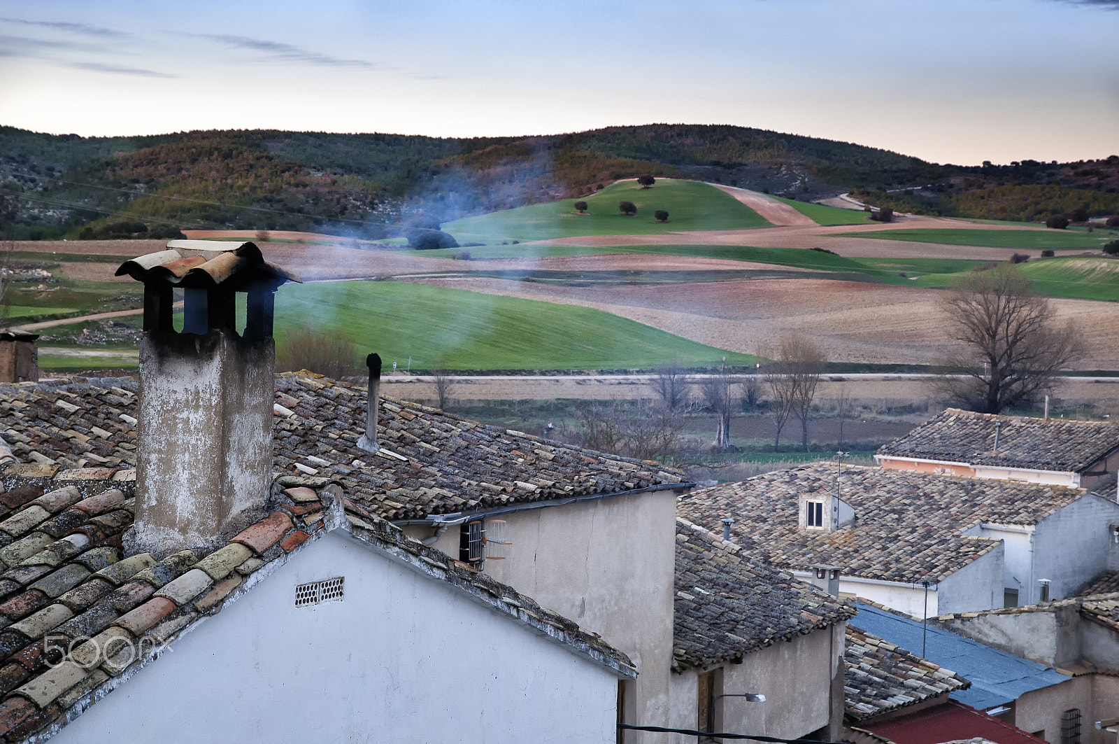 Nikon D300 + Nikon AF-S DX Nikkor 16-85mm F3.5-5.6G ED VR sample photo. Village houses, smoke comes out of a chimney. photography