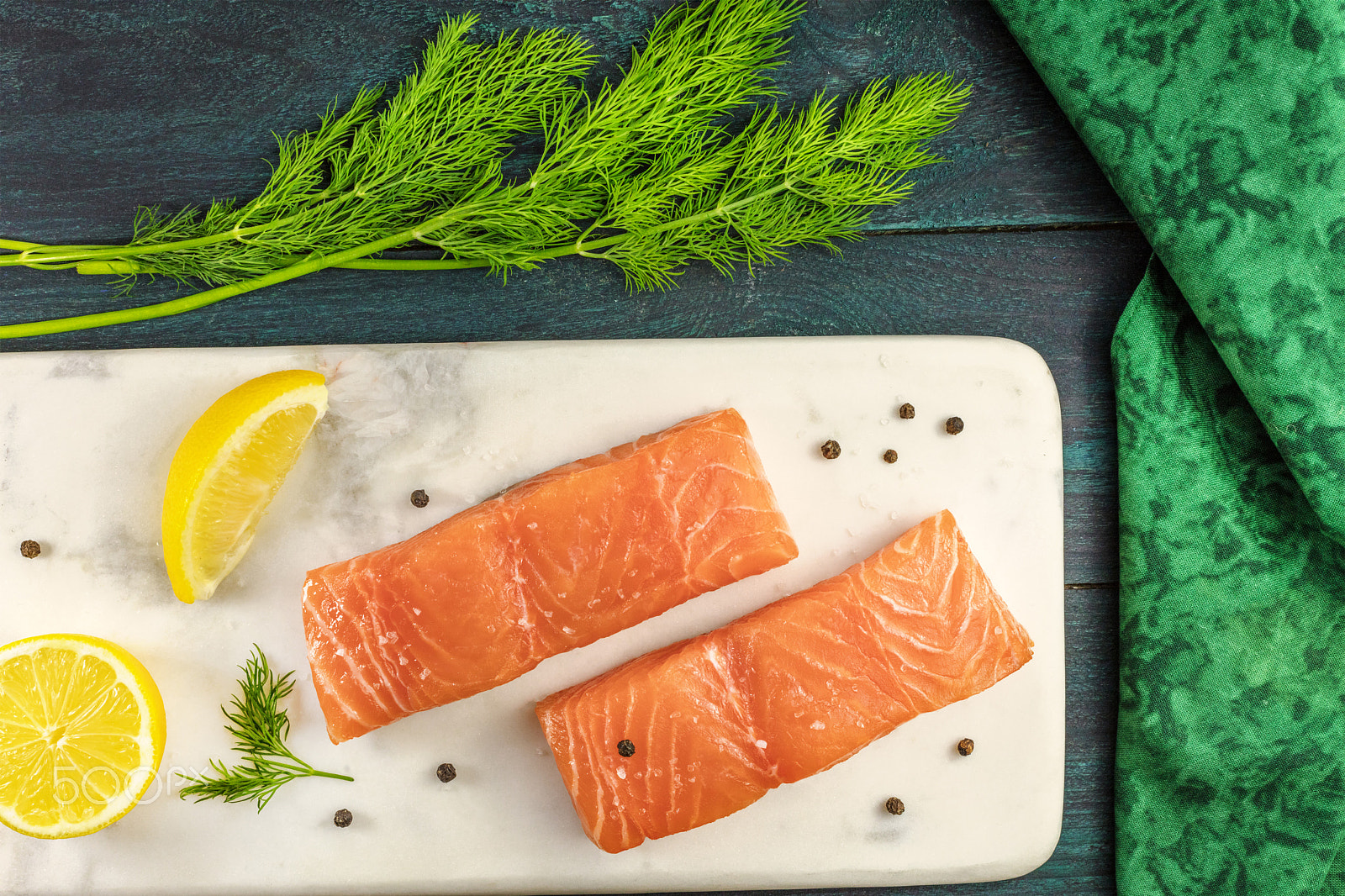 Canon EOS 5DS R sample photo. Two slices of salmon on dark background with copyspace photography