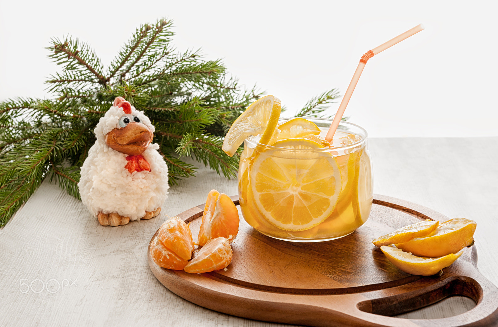 Nikon AF-S Nikkor 24-70mm F2.8G ED sample photo. On a wooden background with drink in clear glass cup with slices of oranges and lemons with the... photography