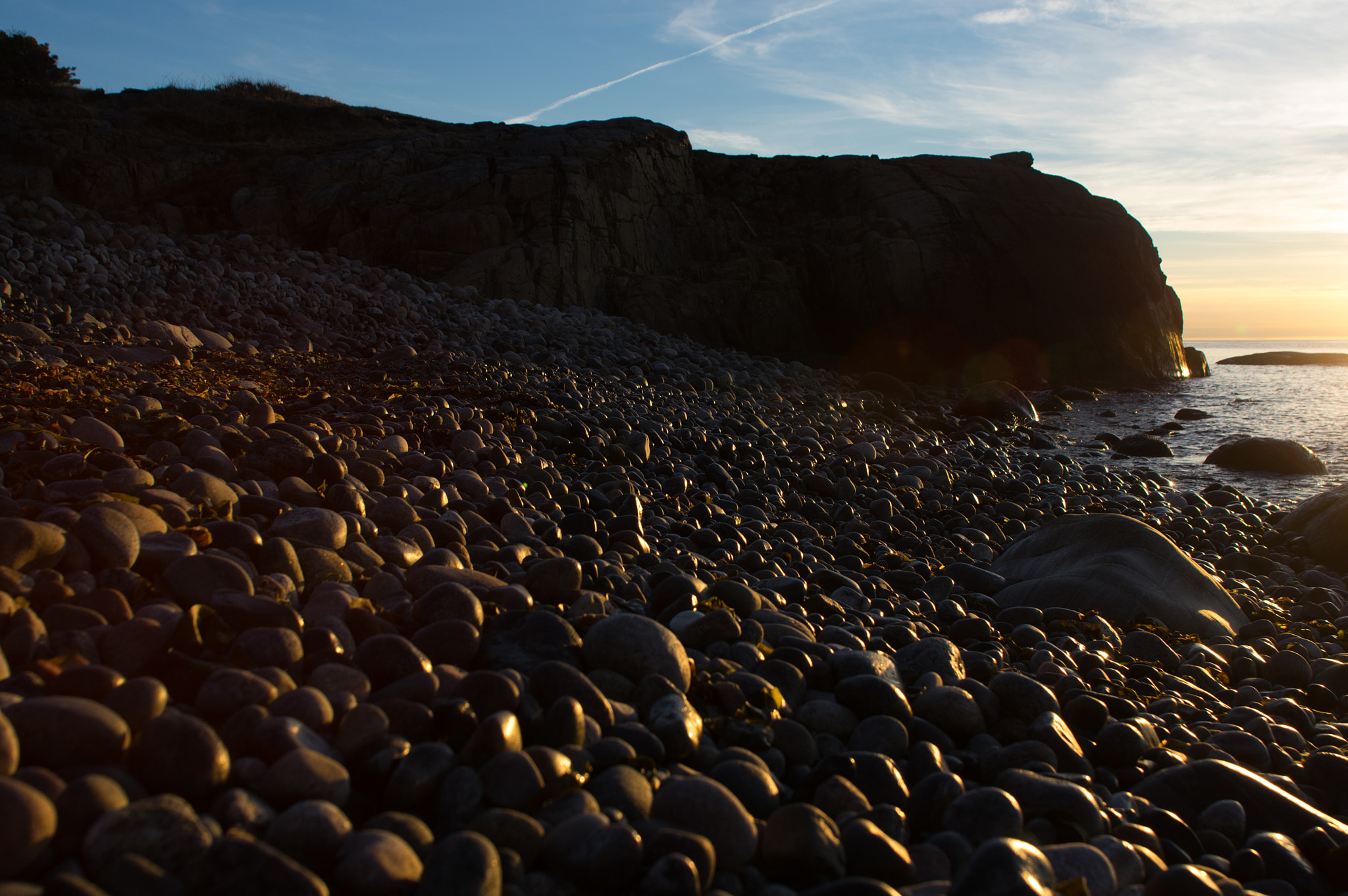 Sigma sample photo. Warm light on rocky beach photography