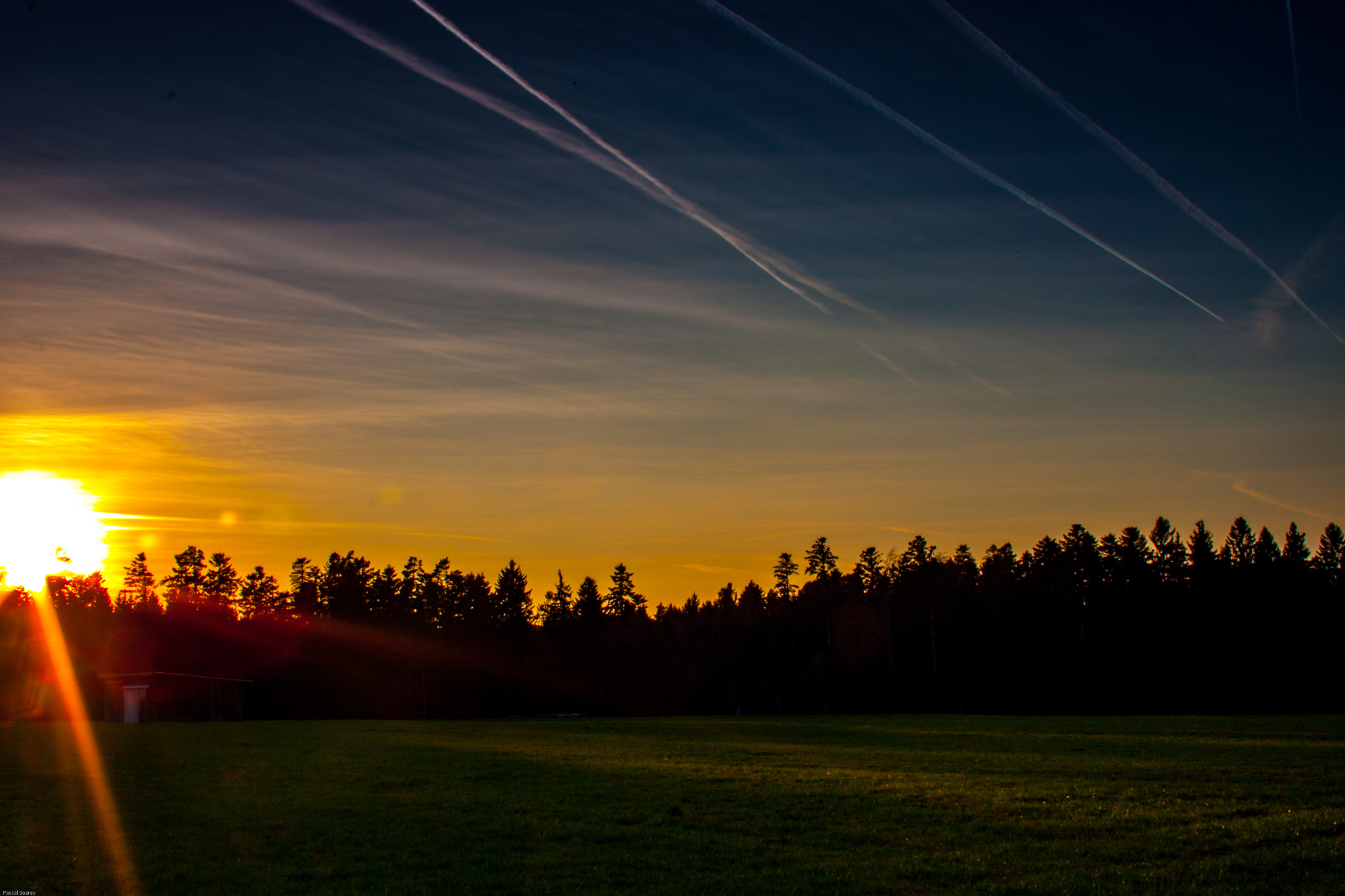 Canon EF-S 18-55mm F3.5-5.6 II sample photo. Sunset over the forest photography