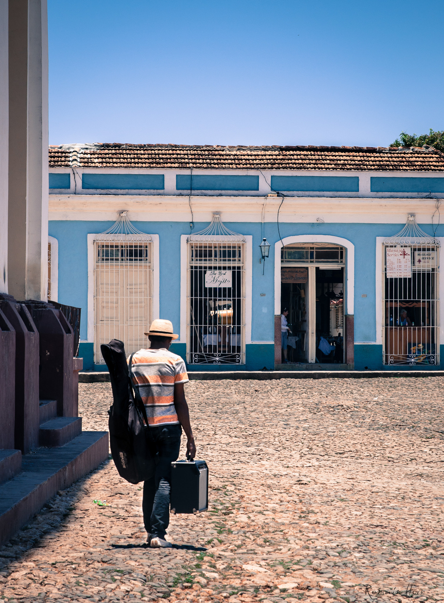 Sigma 24-70mm F2.8 EX DG HSM sample photo. Cuban musician walking in the streets of trinidad photography