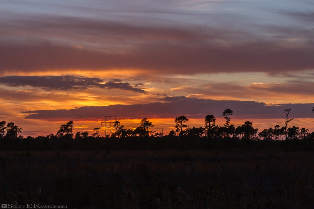 Canon EF 28-135mm F3.5-5.6 IS USM sample photo. Orange sunset over barefoot landing photography