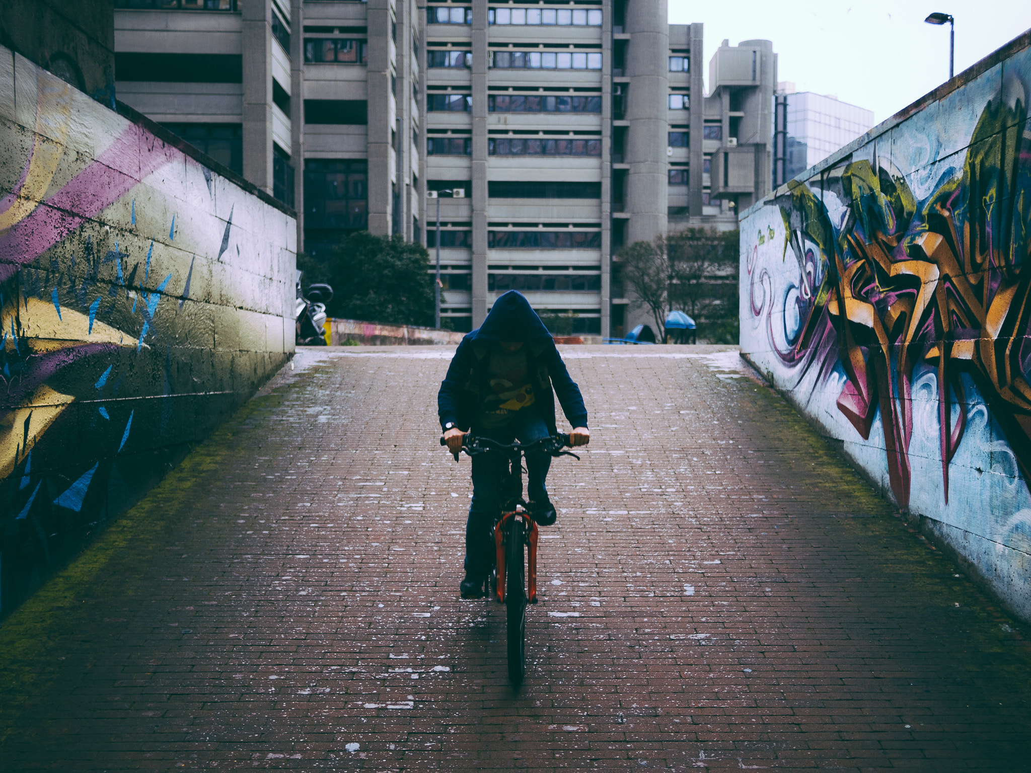 Olympus OM-D E-M10 sample photo. Cycling in the rain photography