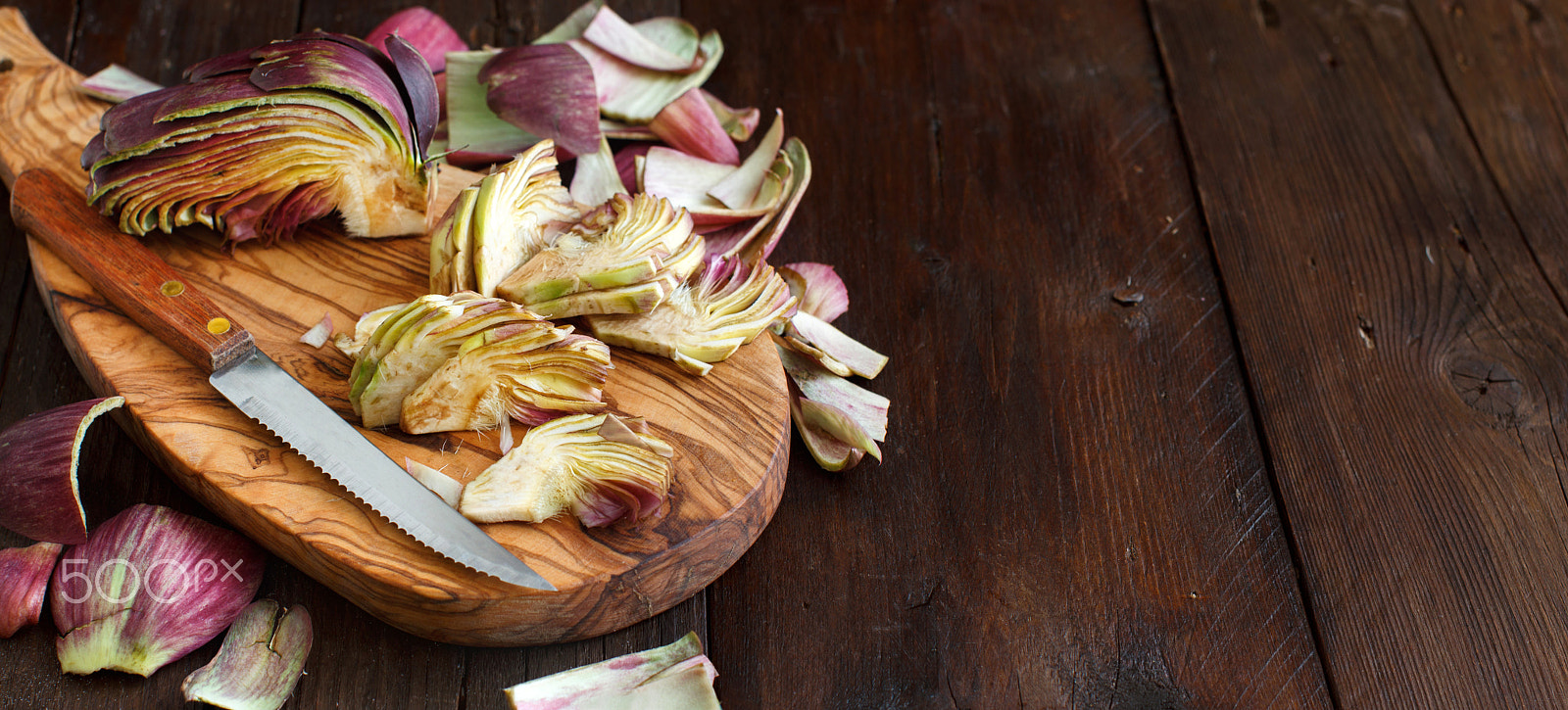 Canon EF 50mm F1.2L USM sample photo. Roman artichokes on a wooden board photography