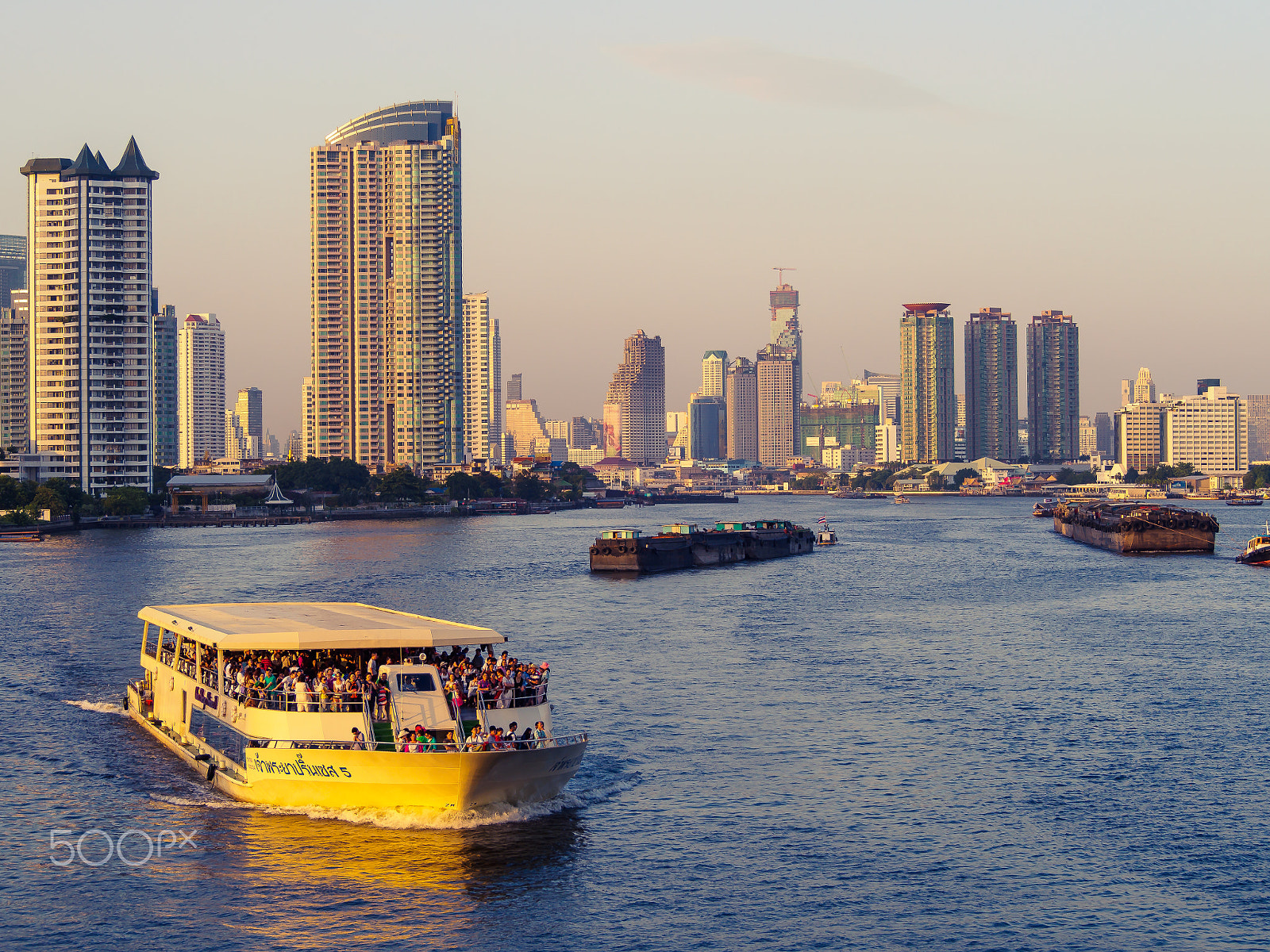 Olympus OM-D E-M5 sample photo. Big ferry in the river of metropolis at sunset. photography