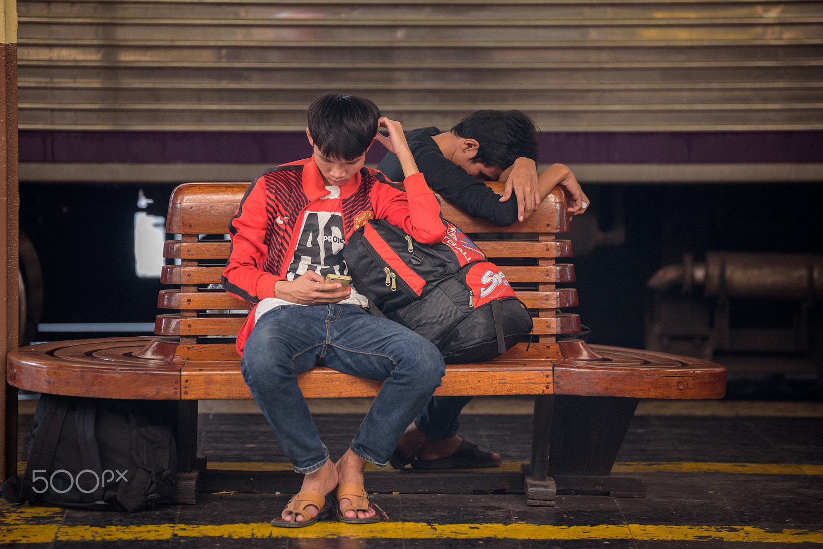 Tamron SP 70-200mm F2.8 Di VC USD sample photo. Two unidentify people waiting for train in station. photography