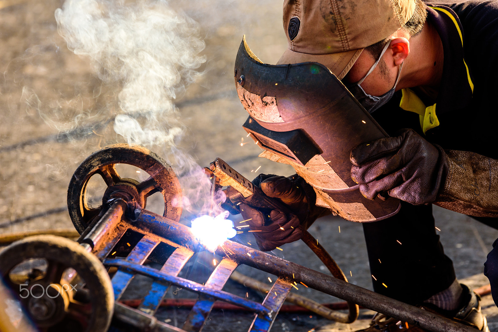 Nikon D750 + Tamron SP 70-200mm F2.8 Di VC USD sample photo. Mechanic welding the cart. photography