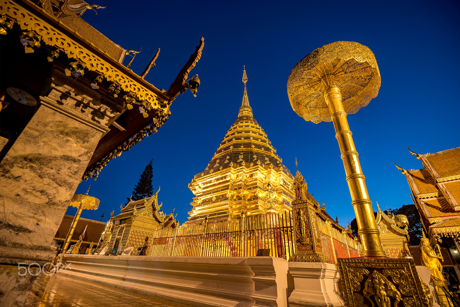 Tamron SP 15-30mm F2.8 Di VC USD sample photo. Gold pagoda and gold buddha statue with blue sky at wat phra tha photography