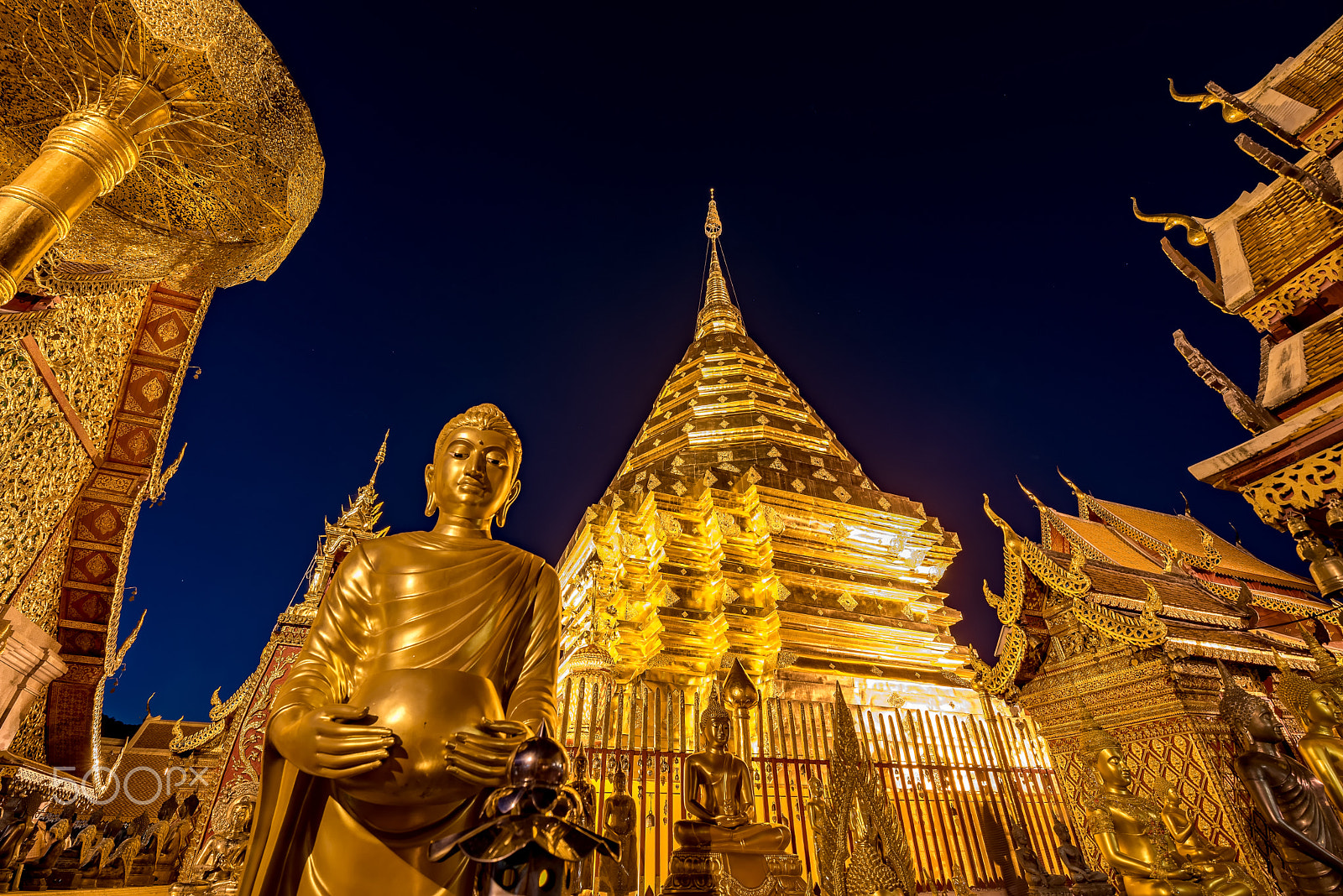 Tamron SP 15-30mm F2.8 Di VC USD sample photo. Gold pagoda and gold buddha statue with blue sky at wat phra tha photography