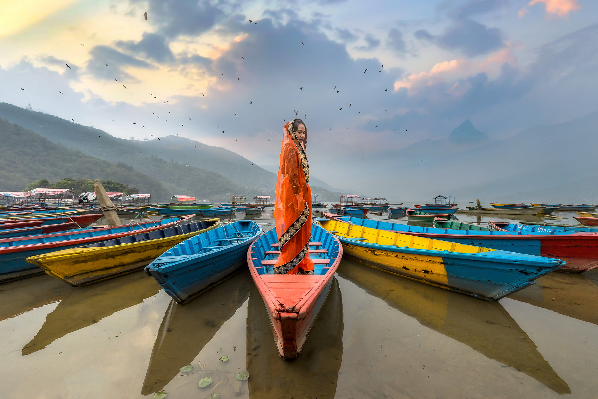 Nikon D4 sample photo. Women in sari standing on the boat,phewa lake,pokhara city , nep photography