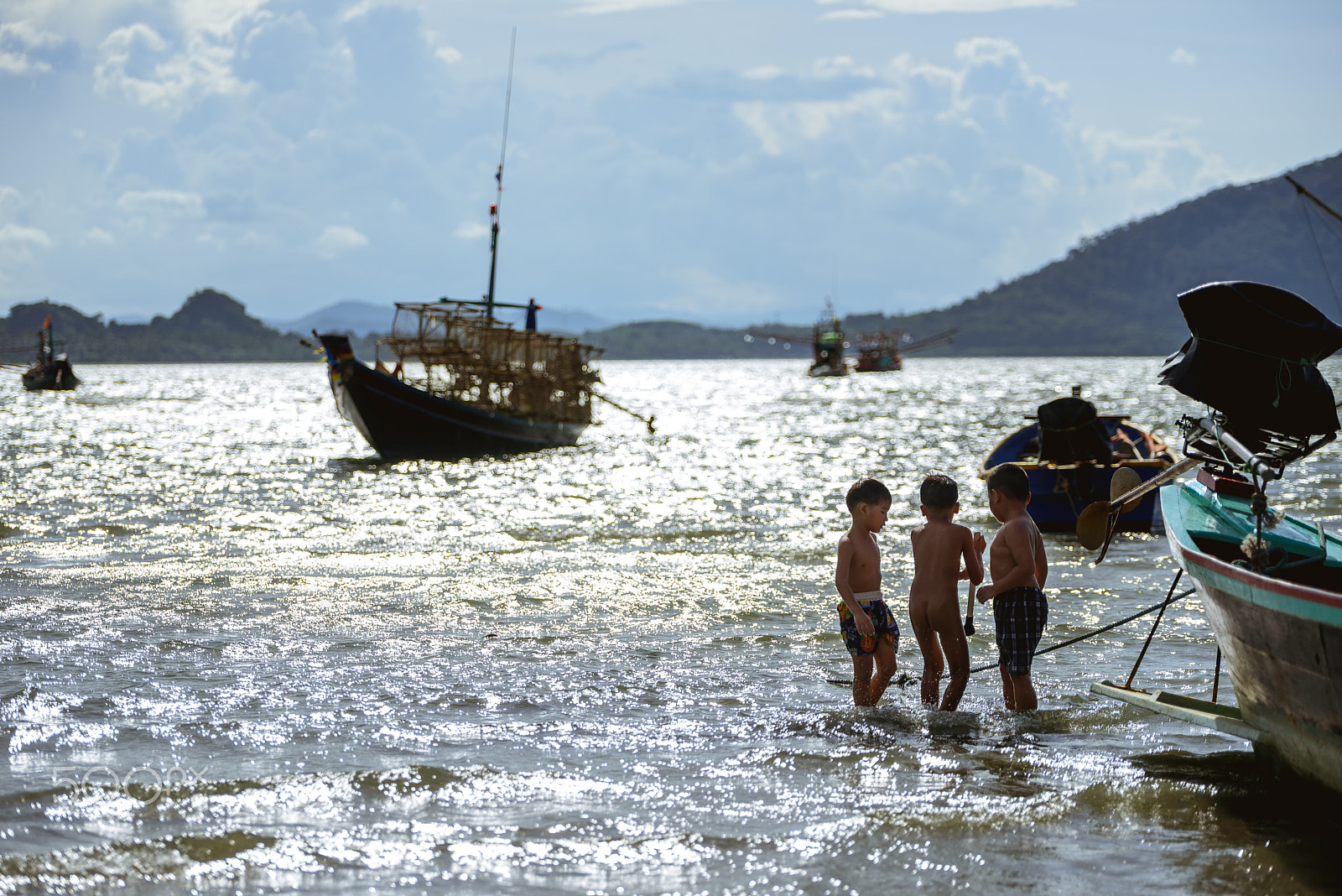 Nikon D750 + Tamron SP 70-200mm F2.8 Di VC USD sample photo. Children who are the son of fishermen are playing beside the boa photography