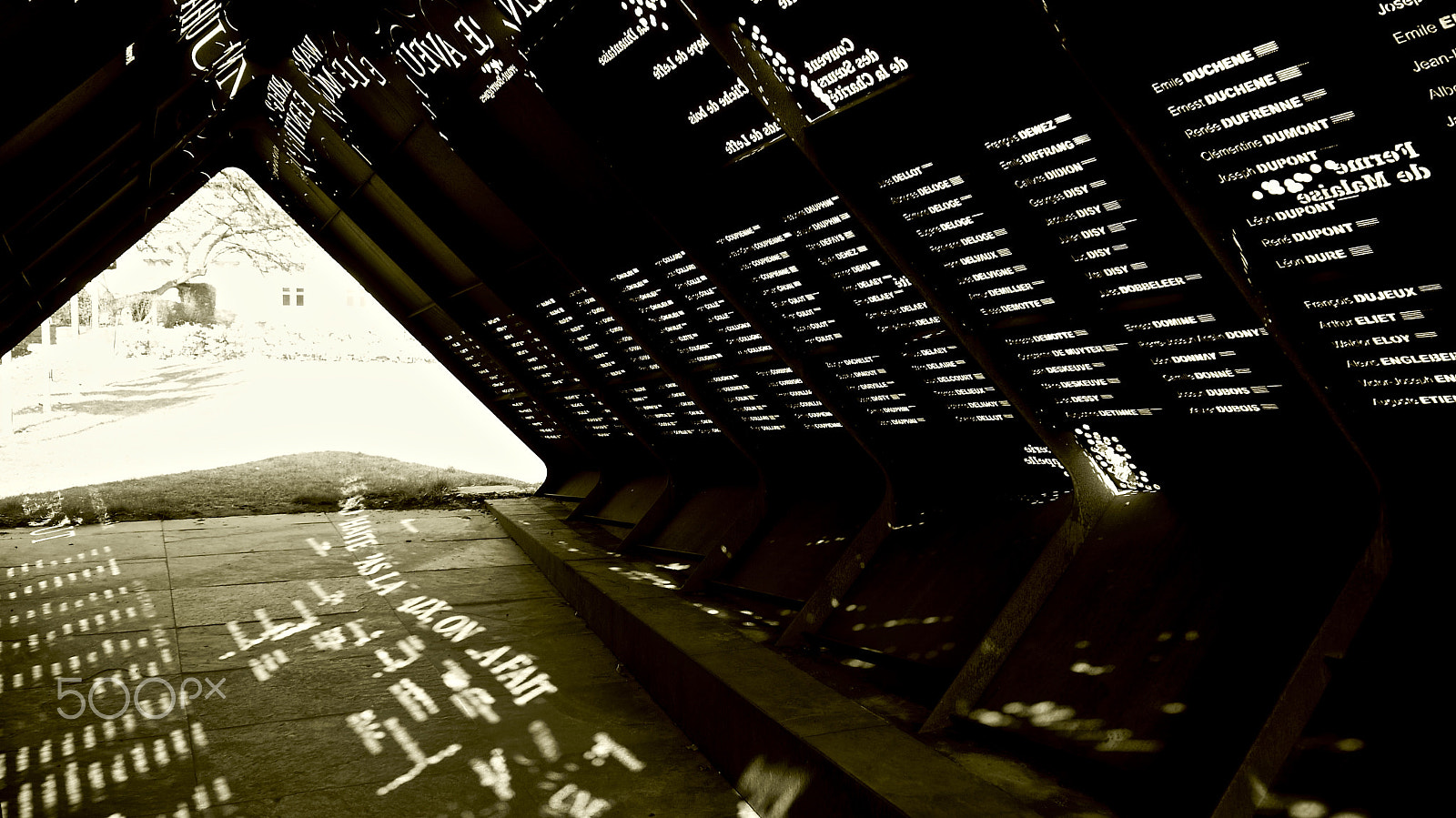 Panasonic Lumix G Vario 14-42mm F3.5-5.6 ASPH OIS sample photo. The names of the fallen, written in sun light photography