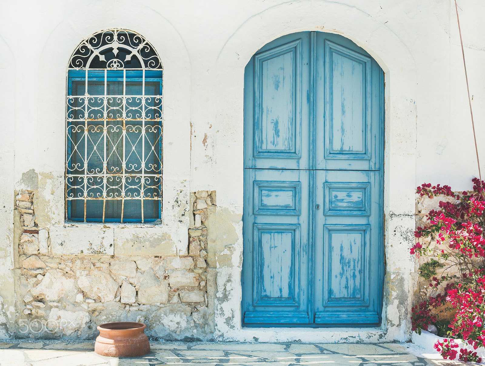 Nikon D610 sample photo. Exterior of greek island traditional street with blue door, kast photography