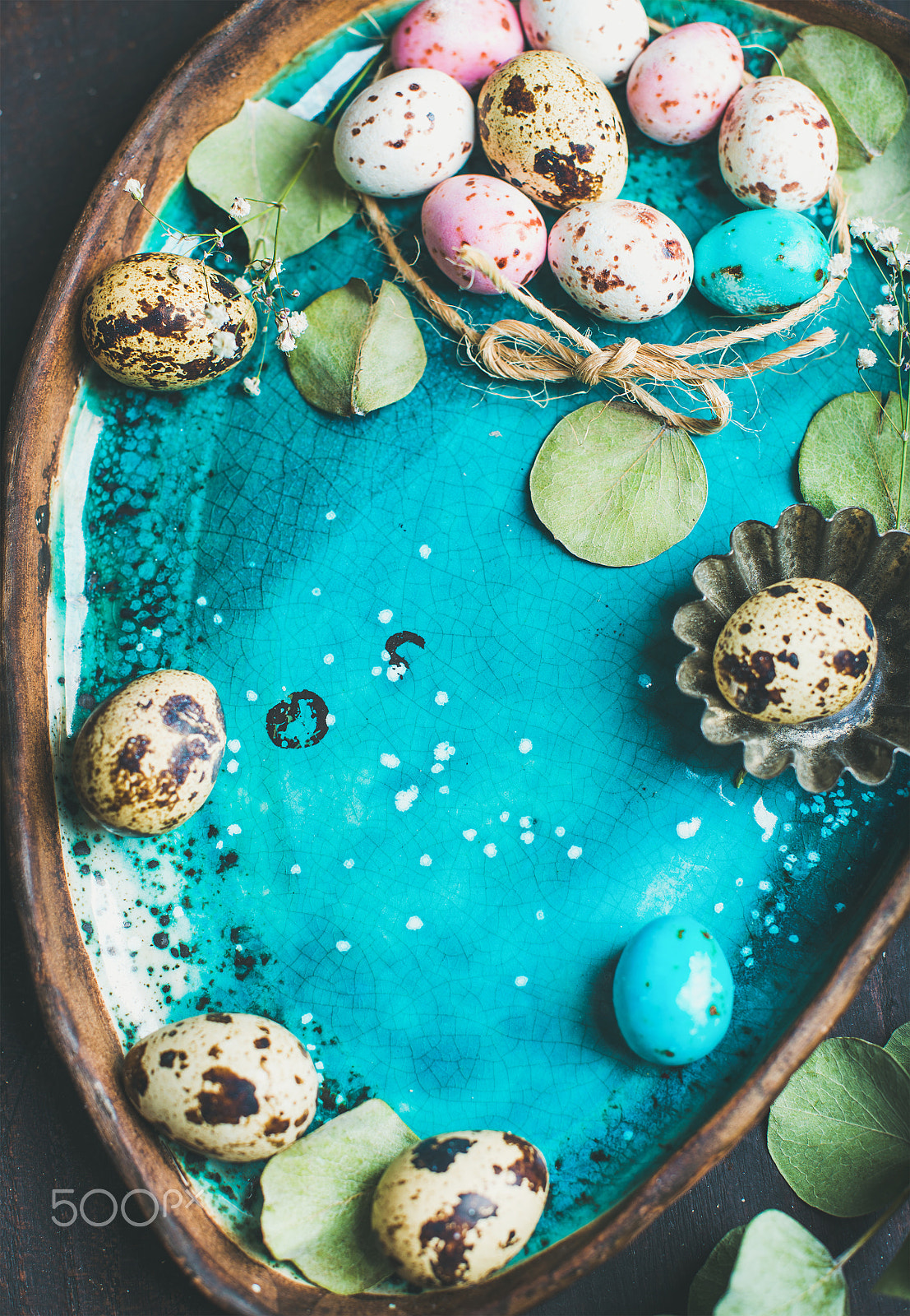 Nikon D610 + Nikon AF-S Nikkor 50mm F1.4G sample photo. Colorful quail eggs, flowers, leaves for easter over blue tray photography