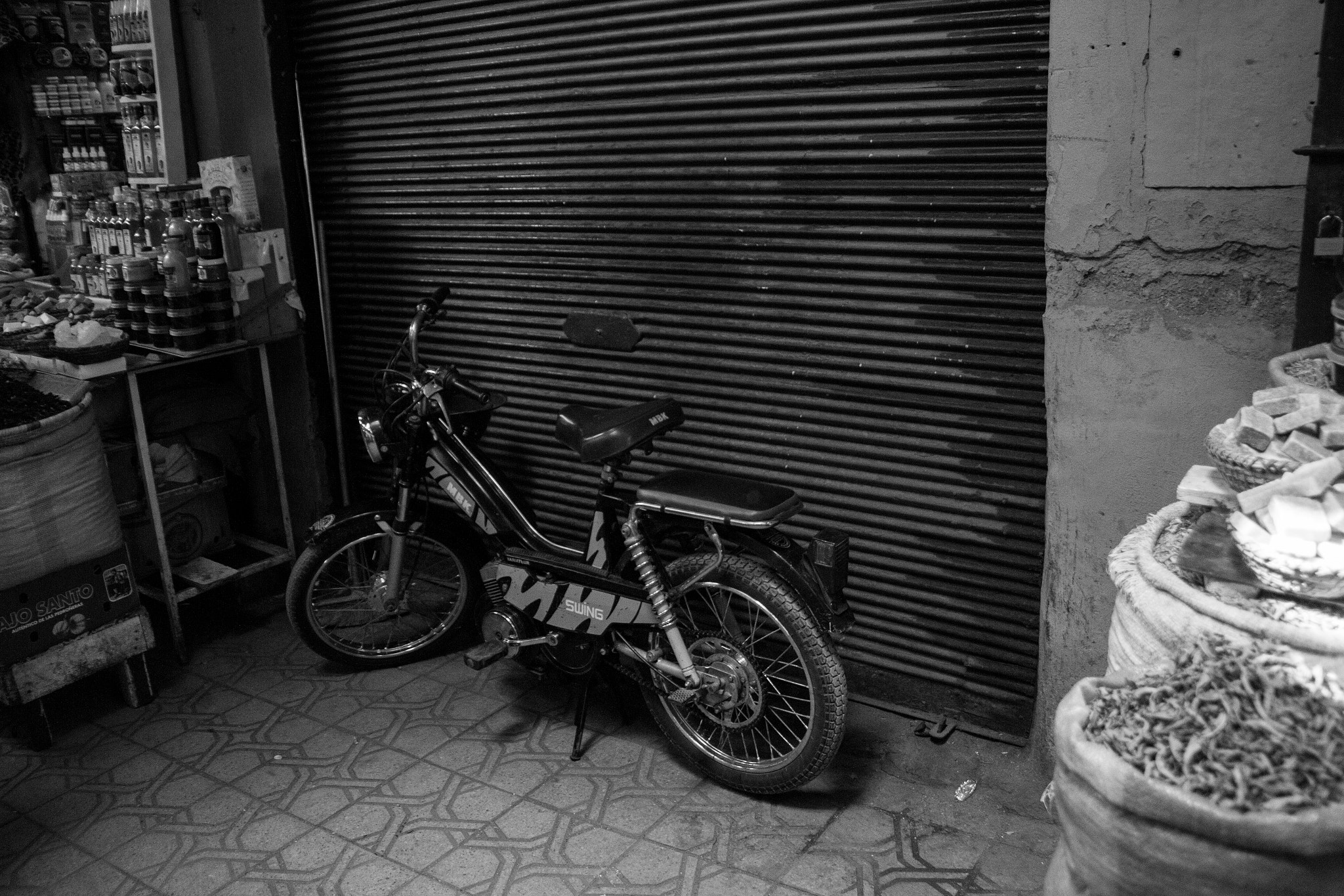 Sigma 18-200mm f/3.5-6.3 DC OS sample photo. Bike in black and white photography