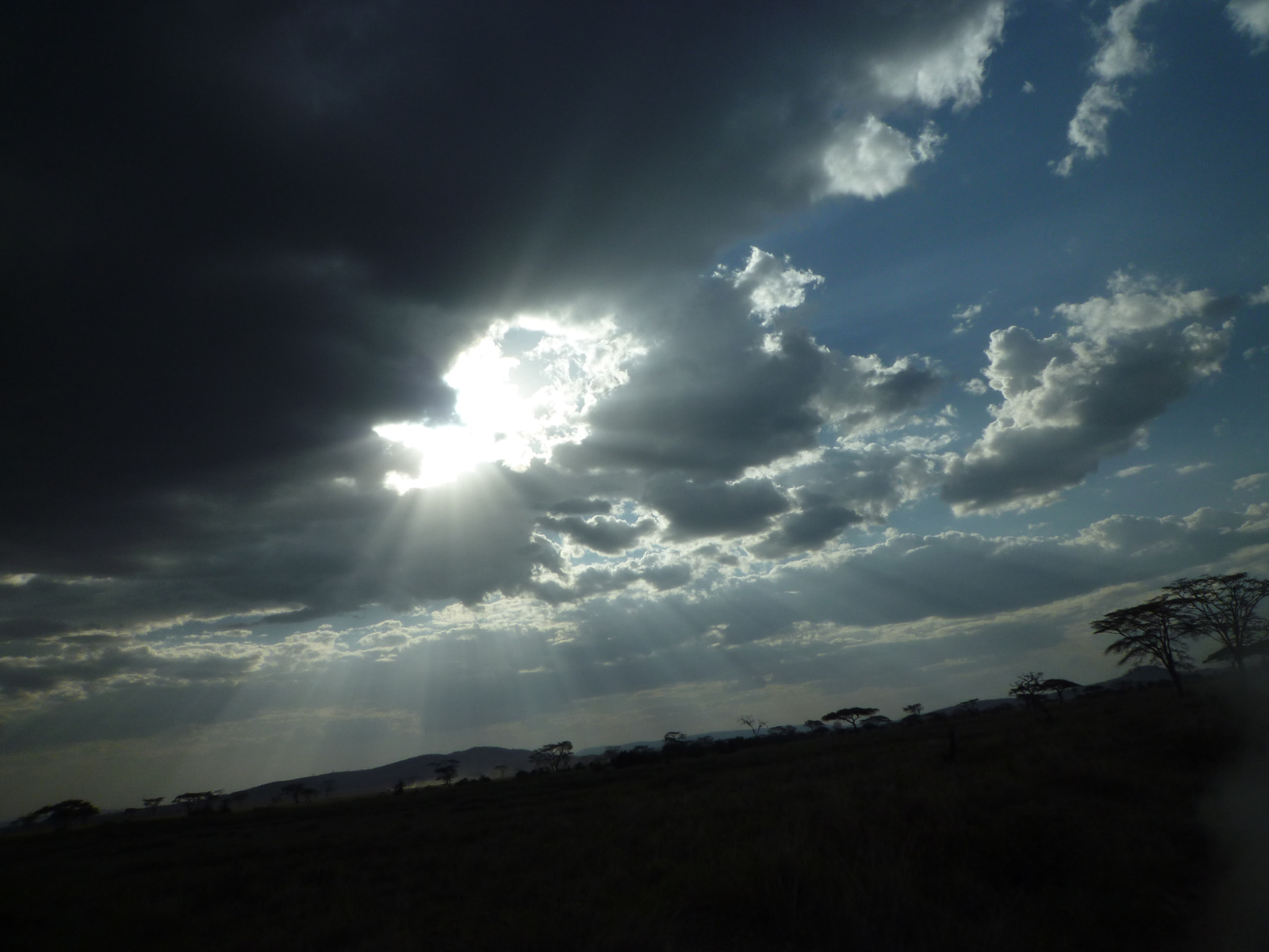 Panasonic DMC-FX48 sample photo. Sun immersing through the clouds photography