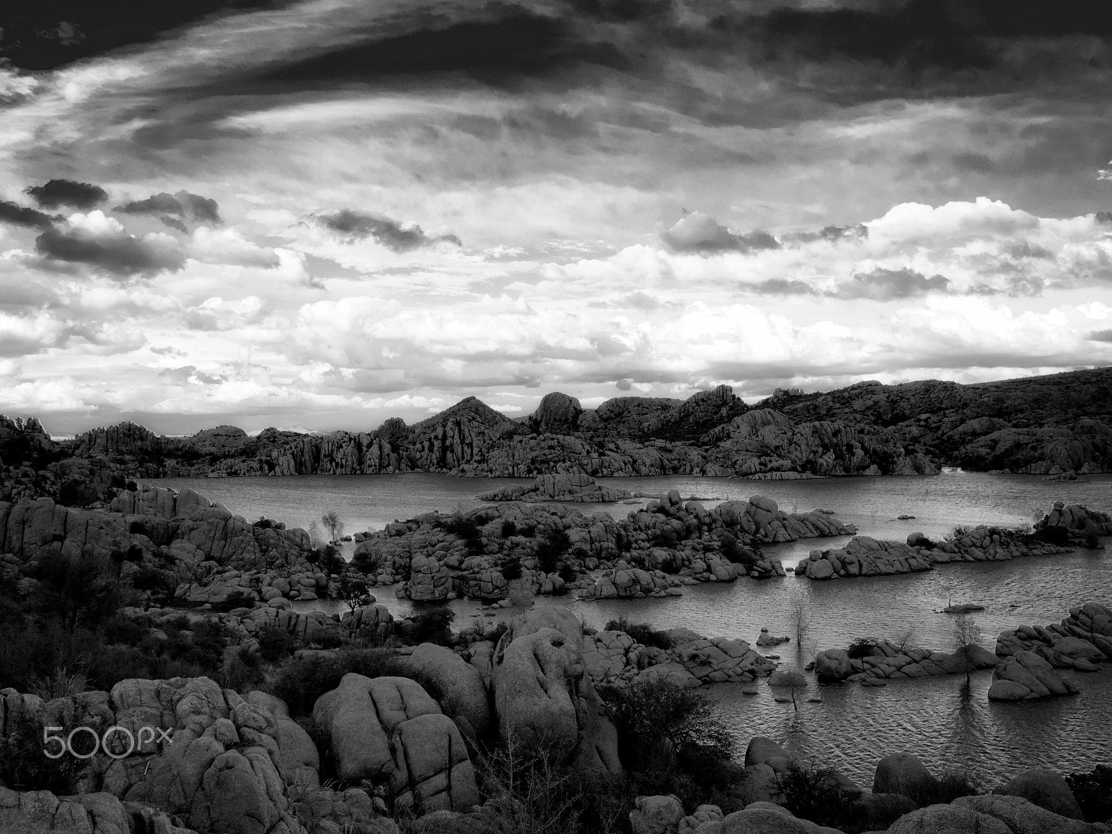 Olympus OM-D E-M5 + Olympus M.Zuiko Digital ED 12-40mm F2.8 Pro sample photo. Watson lake storm clouds photography