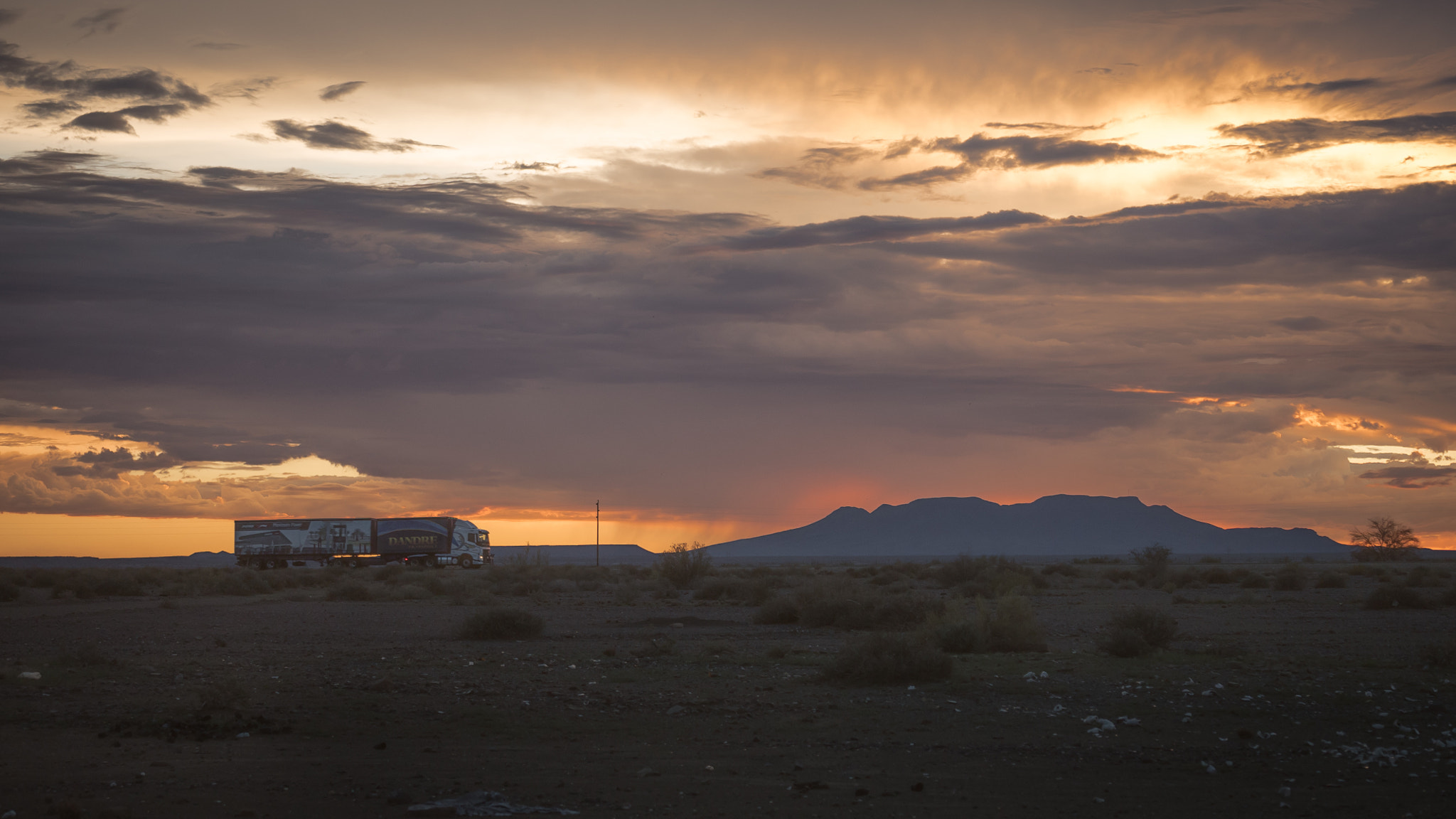 Panasonic Lumix G X Vario 35-100mm F2.8 OIS sample photo. Truck on the road photography