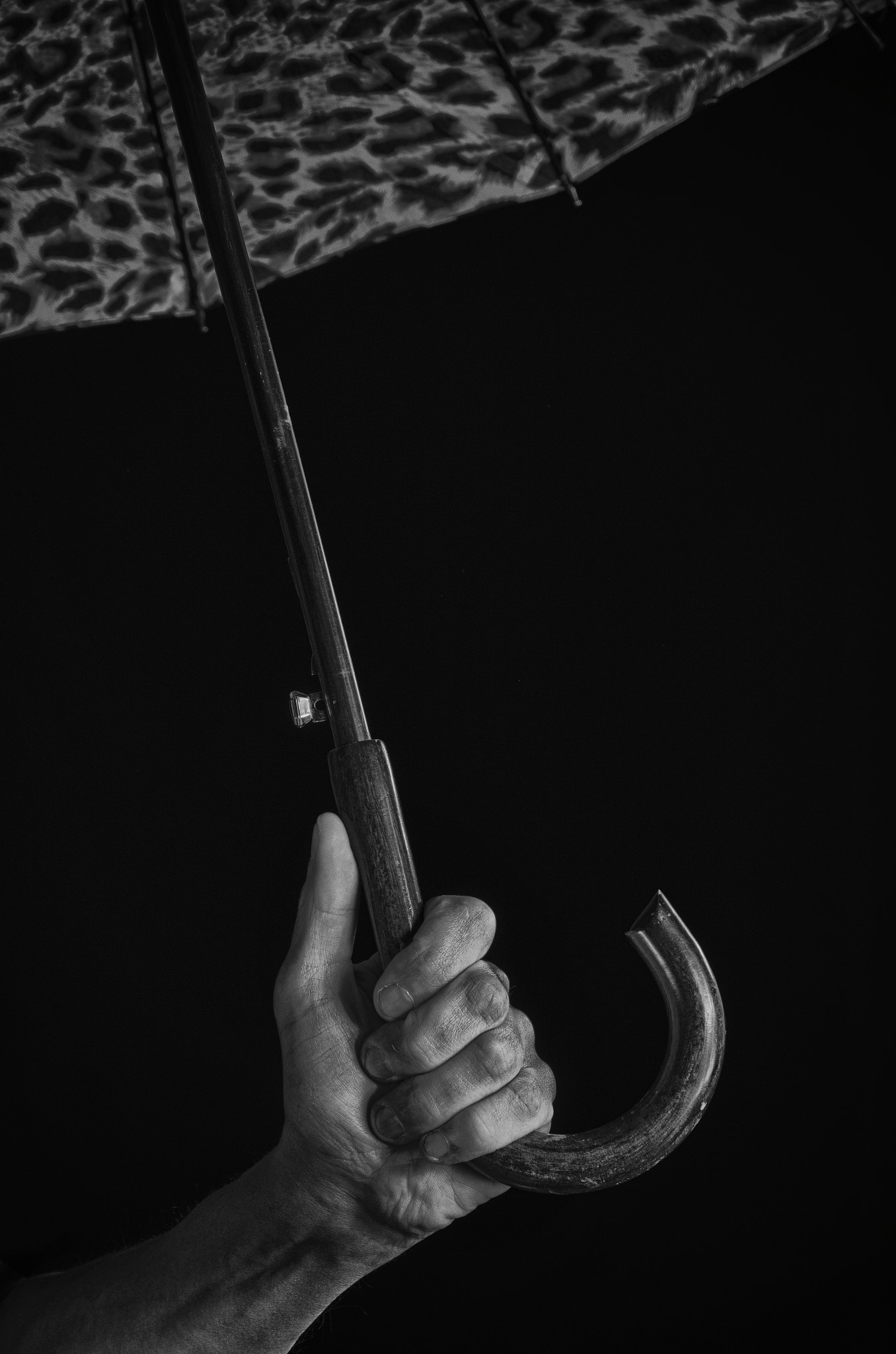 Nikon D5100 sample photo. A man's hand holds an umbrella. photography