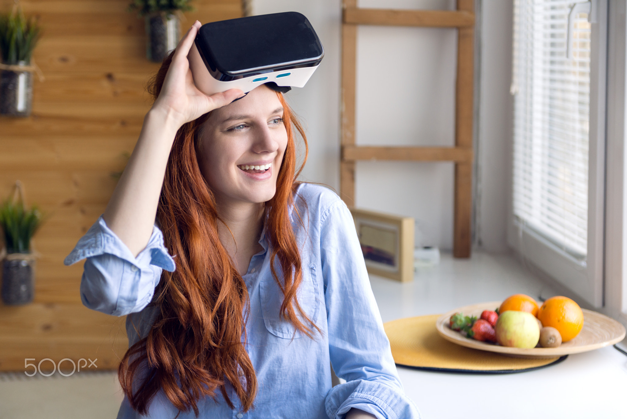 Young woman using VR headset