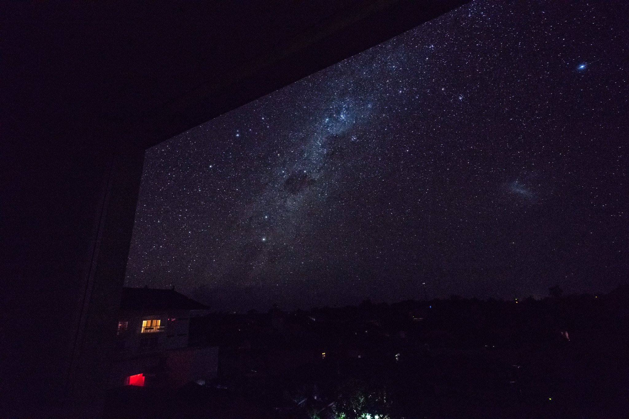 Sony a7R + Sony Vario-Tessar T* FE 16-35mm F4 ZA OSS sample photo. Starscape from middle of denpassar in bali photography