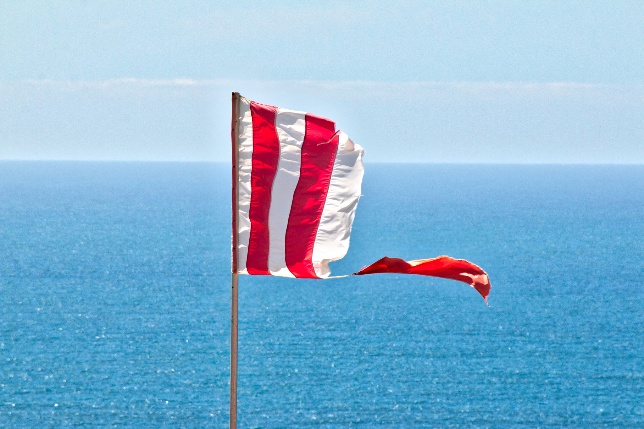 Canon EF-S 55-250mm F4-5.6 IS II sample photo. Worn out flag photography