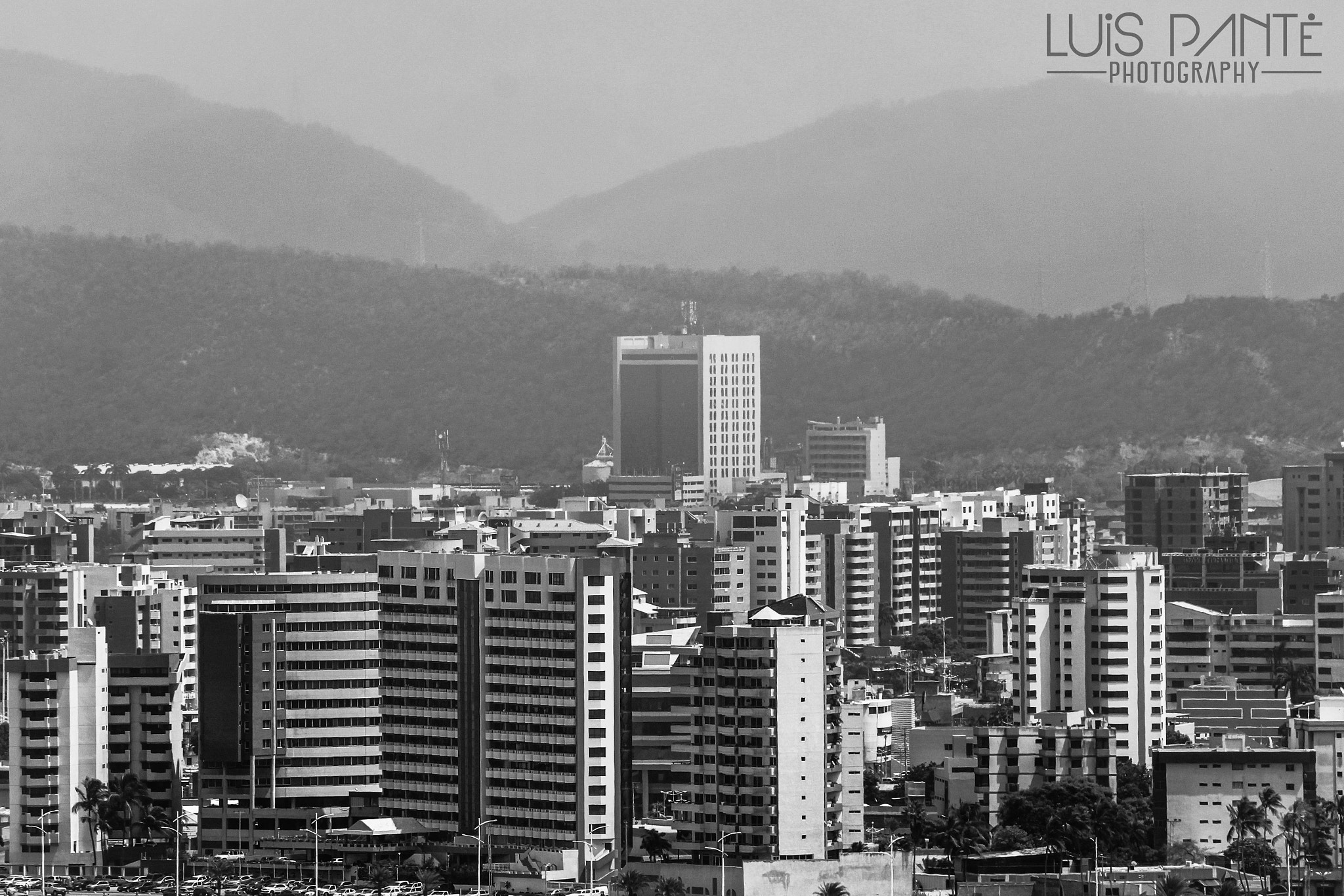 Canon EF-S 55-250mm F4-5.6 IS sample photo. Mountains and city photography