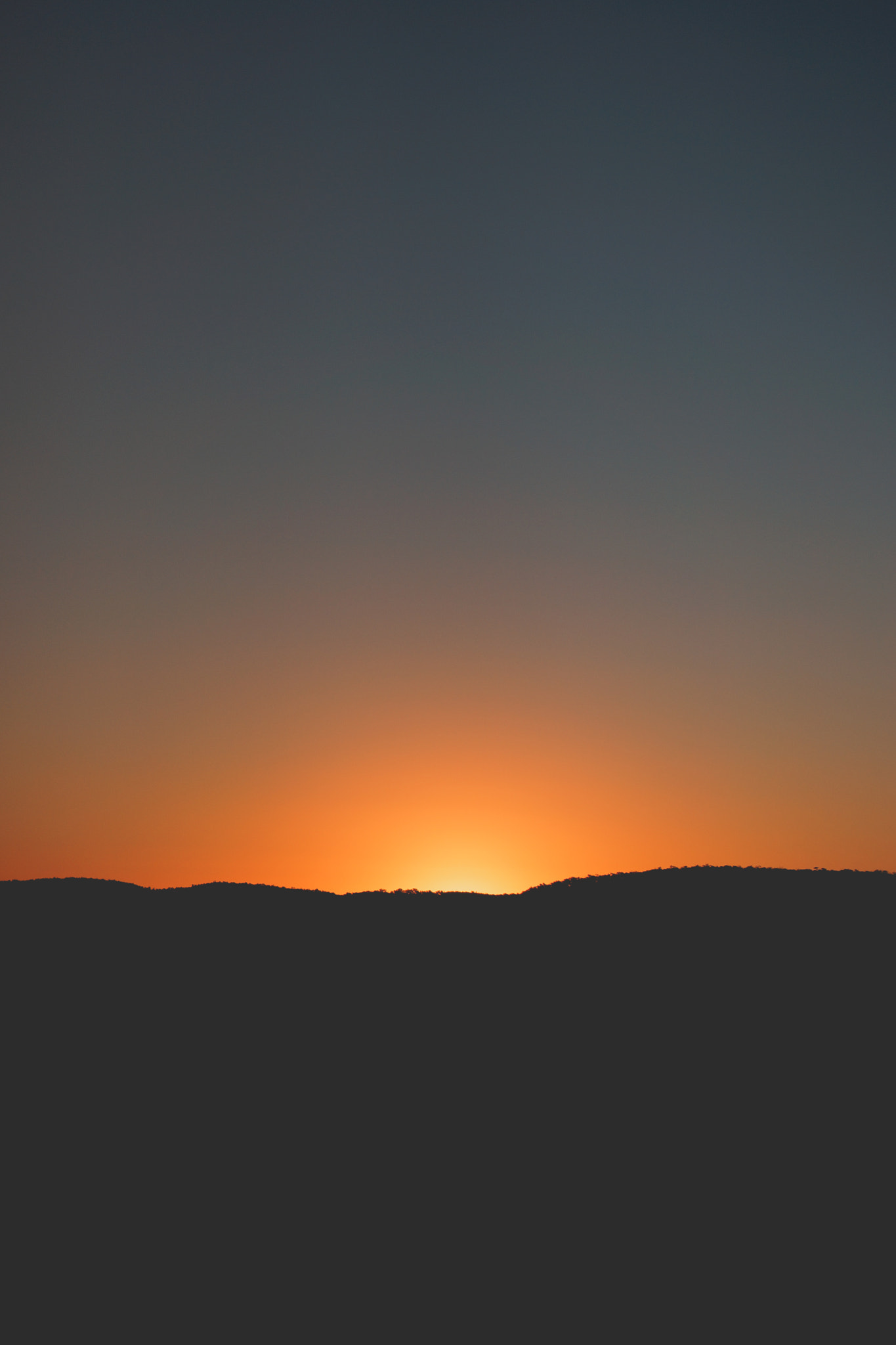 Sony Alpha NEX-7 sample photo. Sunset behind hill photography