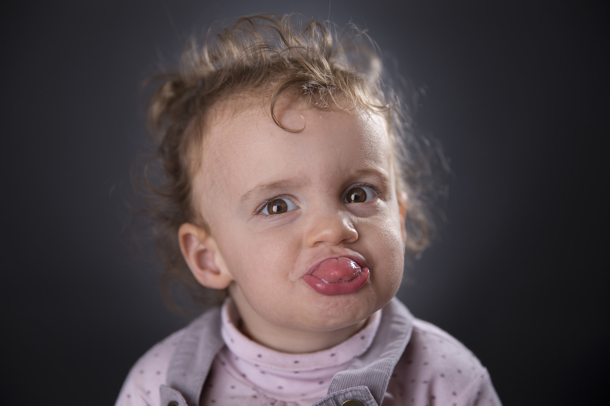 Canon EF 24-70mm F2.8L II USM sample photo. Two years girl sticking out her tongue photography