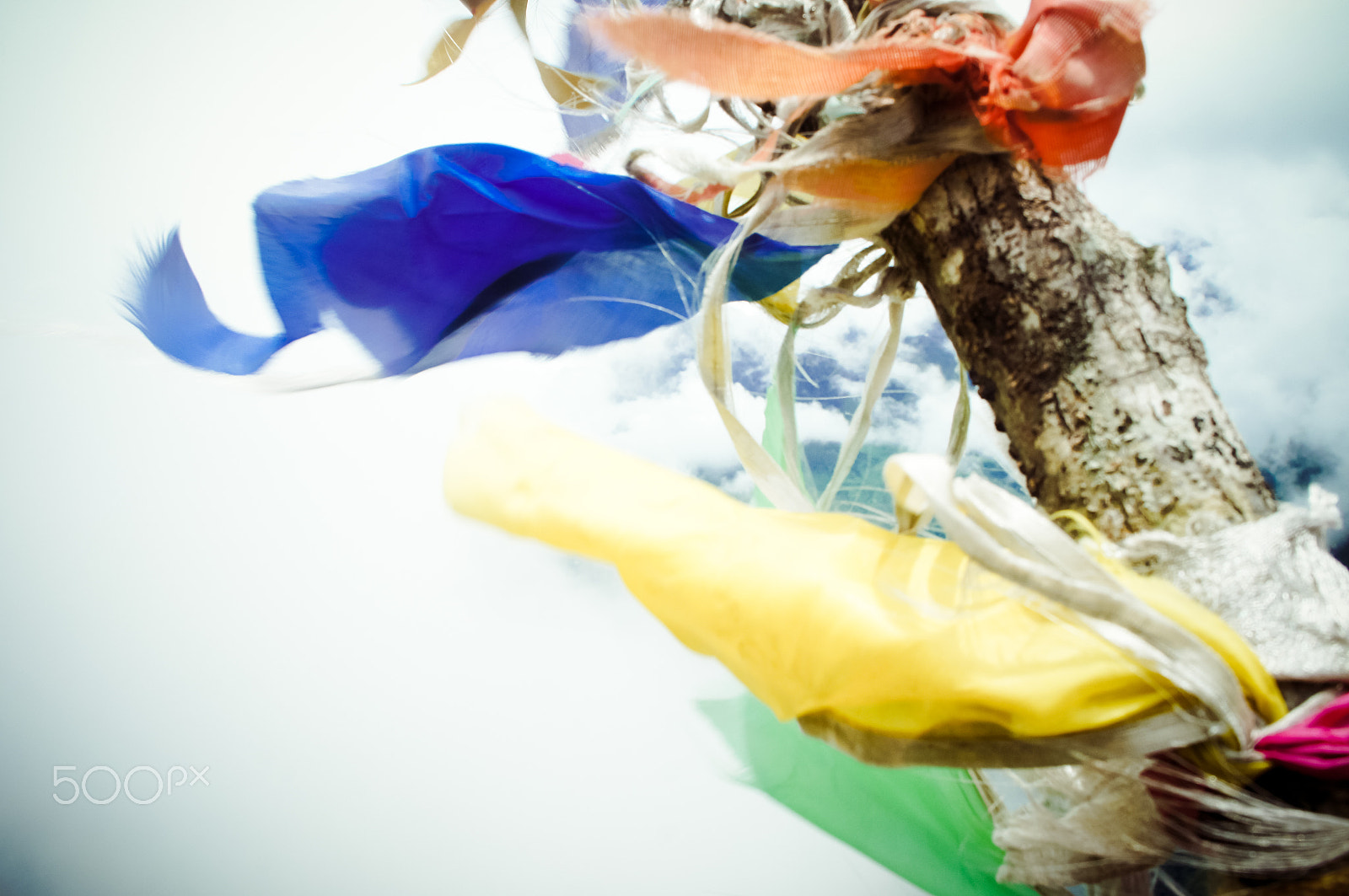 Sony Alpha NEX-C3 + Tamron 18-200mm F3.5-6.3 Di III VC sample photo. Tibetan prayer flags weaving in the wind photography