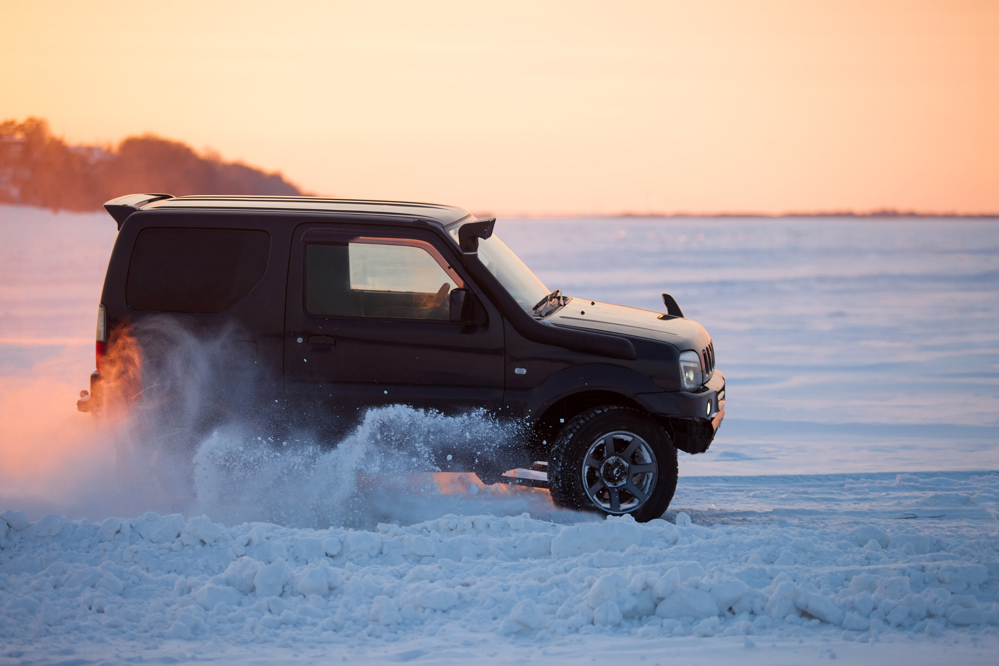 Canon EOS 5D Mark II + Canon EF 80-200mm f/2.8L sample photo. Suzuki jimny moving on ice of a frosn river at sunset photography