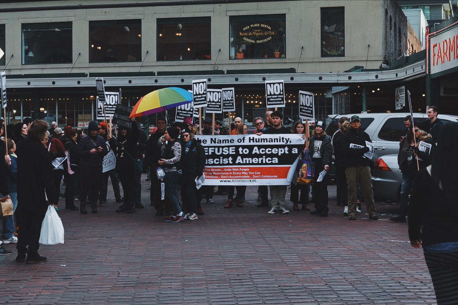 Canon EF-S 17-55mm F2.8 IS USM sample photo. Protest at pike place market, seattle (1) photography