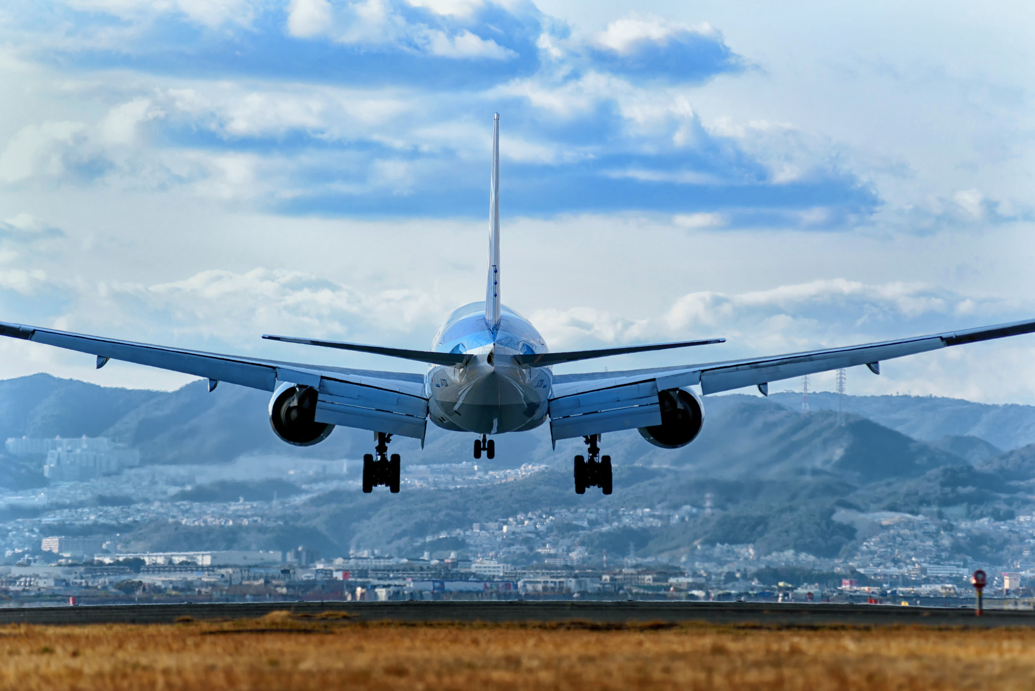 Nikon D750 sample photo. Airplane landing at itami airport photography