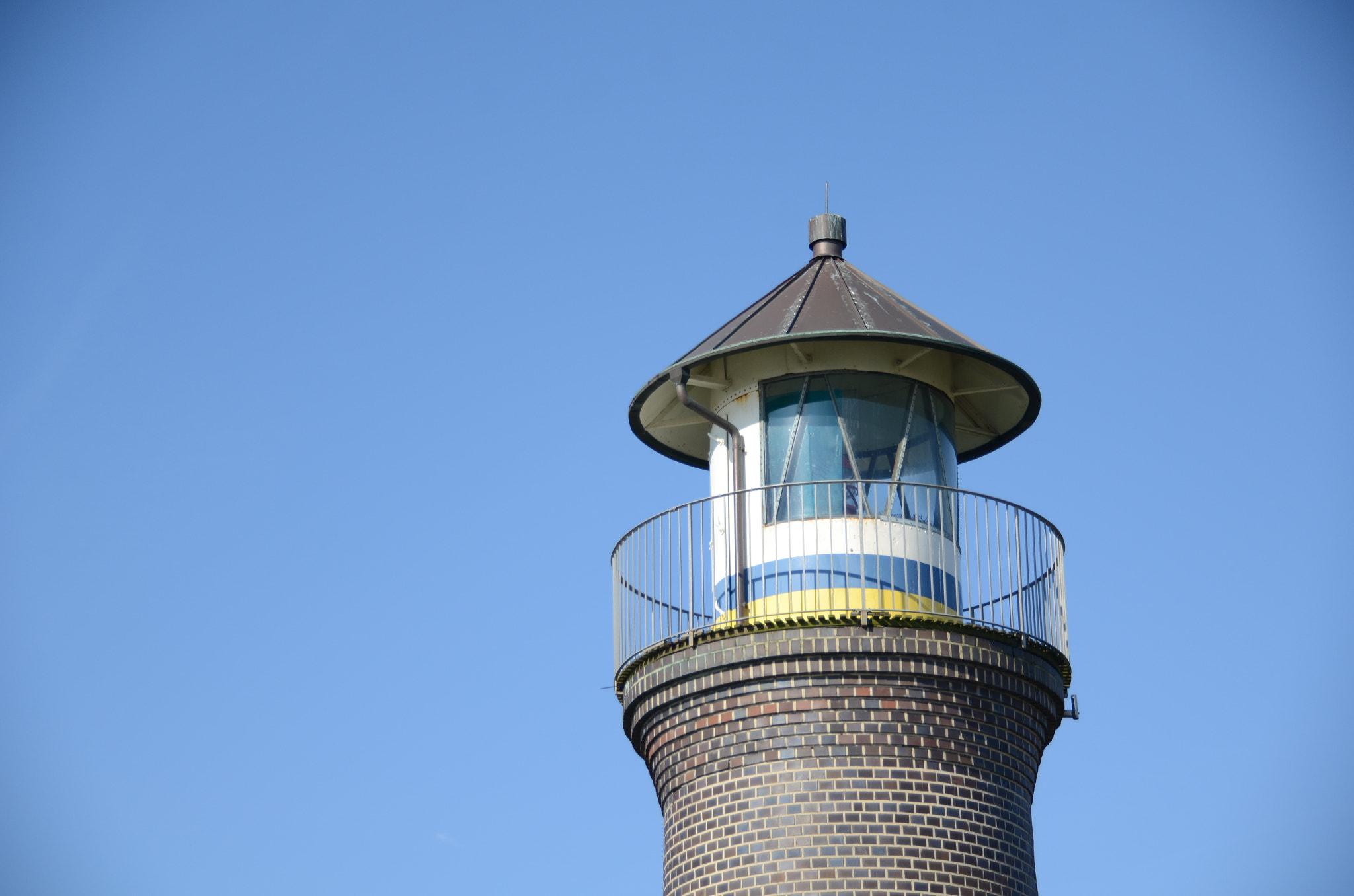 Nikon D7000 + Sigma 18-250mm F3.5-6.3 DC Macro OS HSM sample photo. Lighthouse in the blue photography
