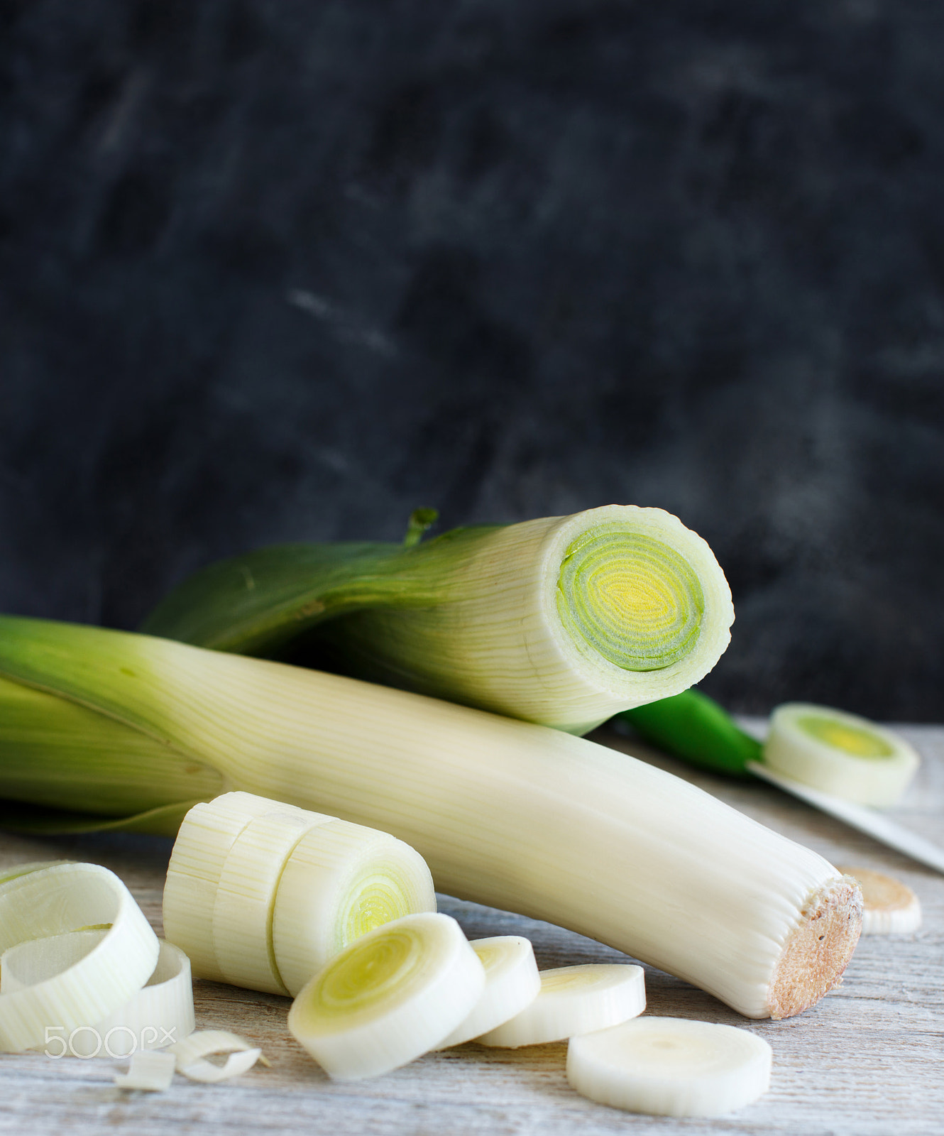 Canon EOS 650D (EOS Rebel T4i / EOS Kiss X6i) + Canon EF 50mm F1.2L USM sample photo. Fresh leeks whole and sliced photography
