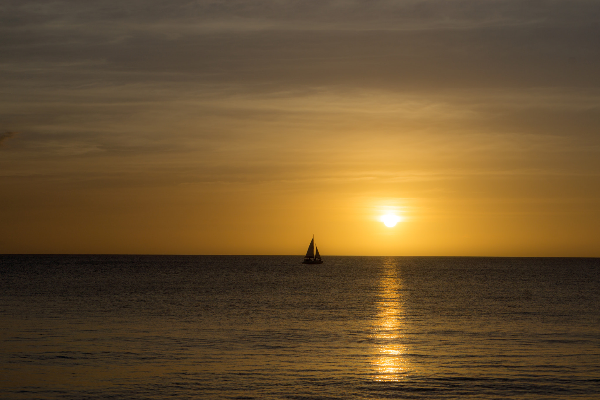 Sony Alpha NEX-7 + E 50mm F1.8 OSS sample photo. Solitary sailboat-sunset at rincon, puerto rico photography