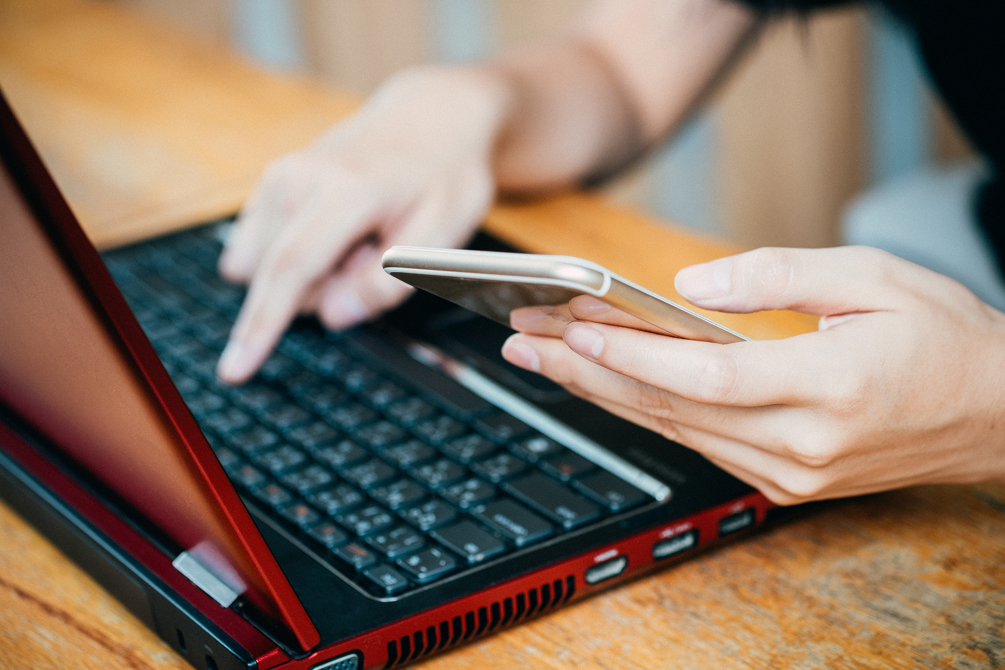 Fujifilm X-A2 sample photo. Woman's hands holding credit card and using laptop, online shopp photography