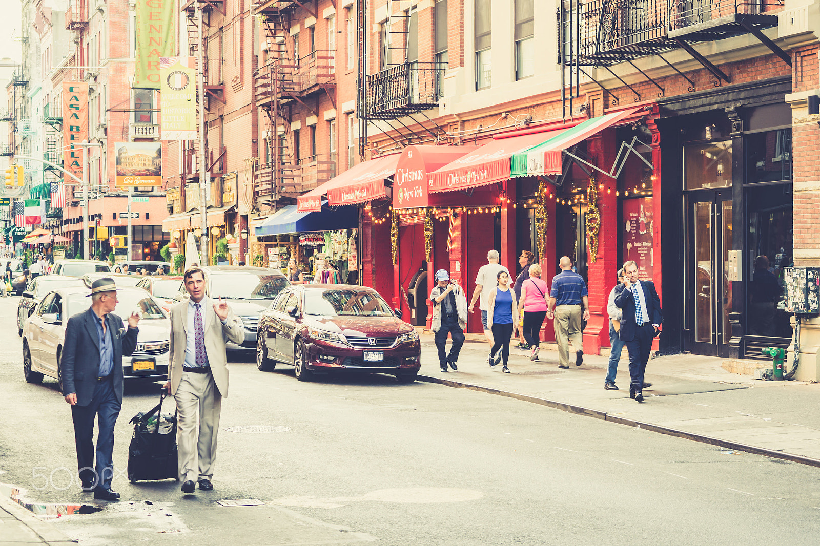 Sony a7 II + Tamron SP 70-300mm F4-5.6 Di USD sample photo. People walking on colorful street photography