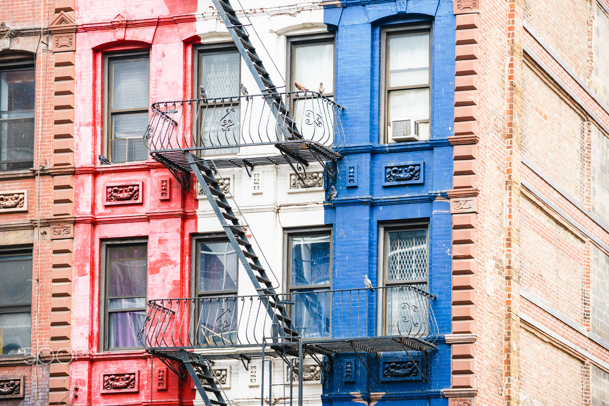 Aged colorful building with balconies