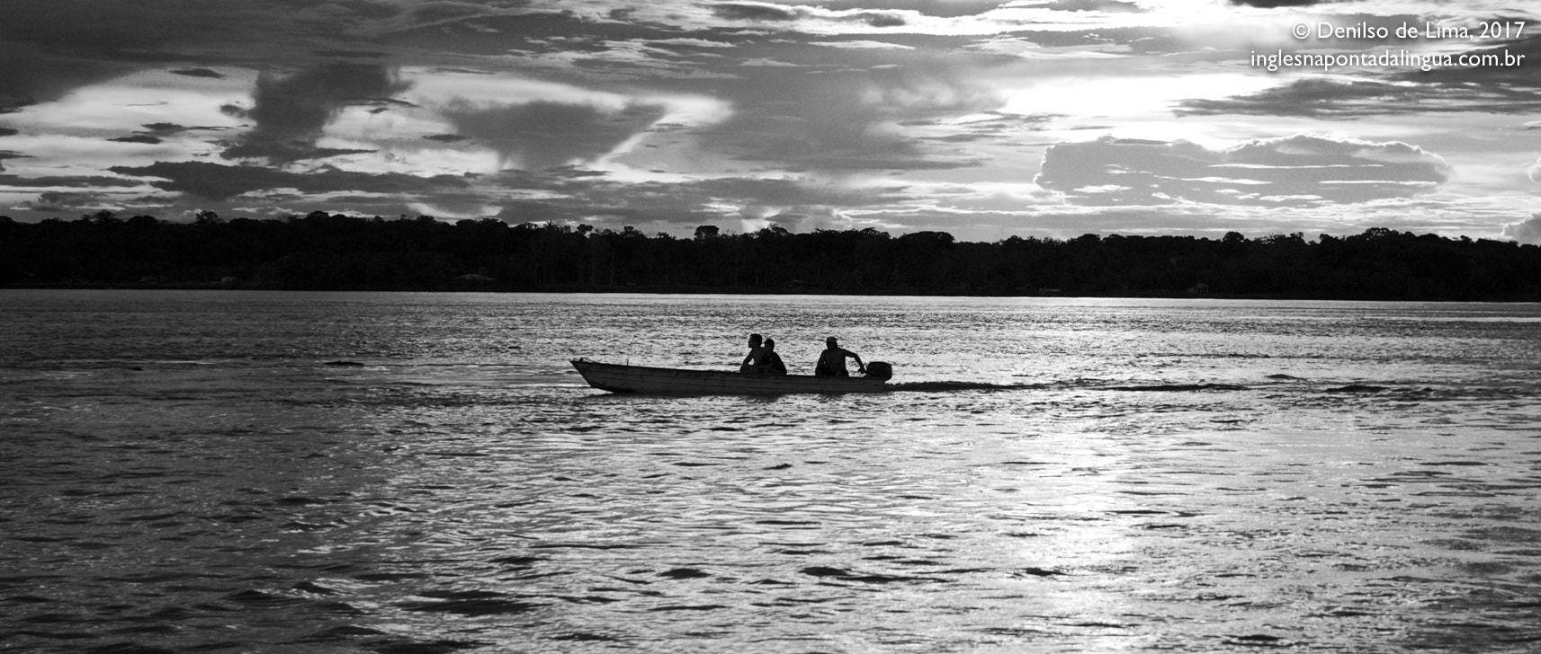 Canon EF-S 18-135mm F3.5-5.6 IS sample photo. Tiny men, small boat, huge river photography