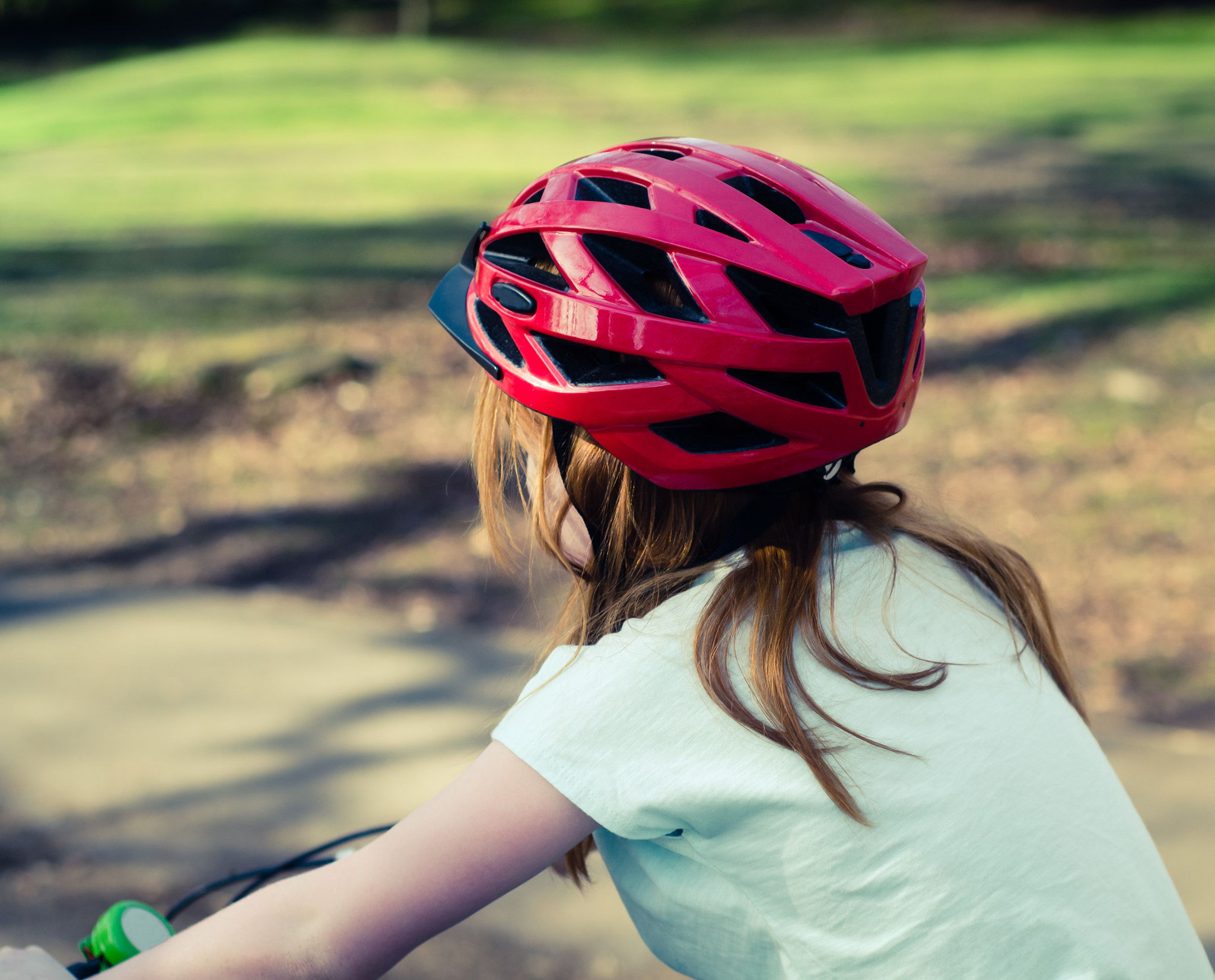 Nikon D7000 sample photo. Girl cycles wearing bike helmet photography