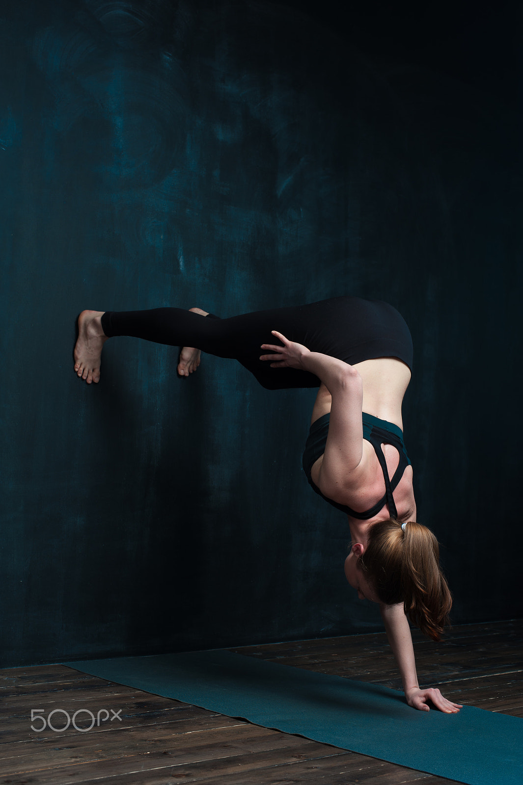 Nikon D700 sample photo. Sporty woman practicing advanced yoga pose indoors photography