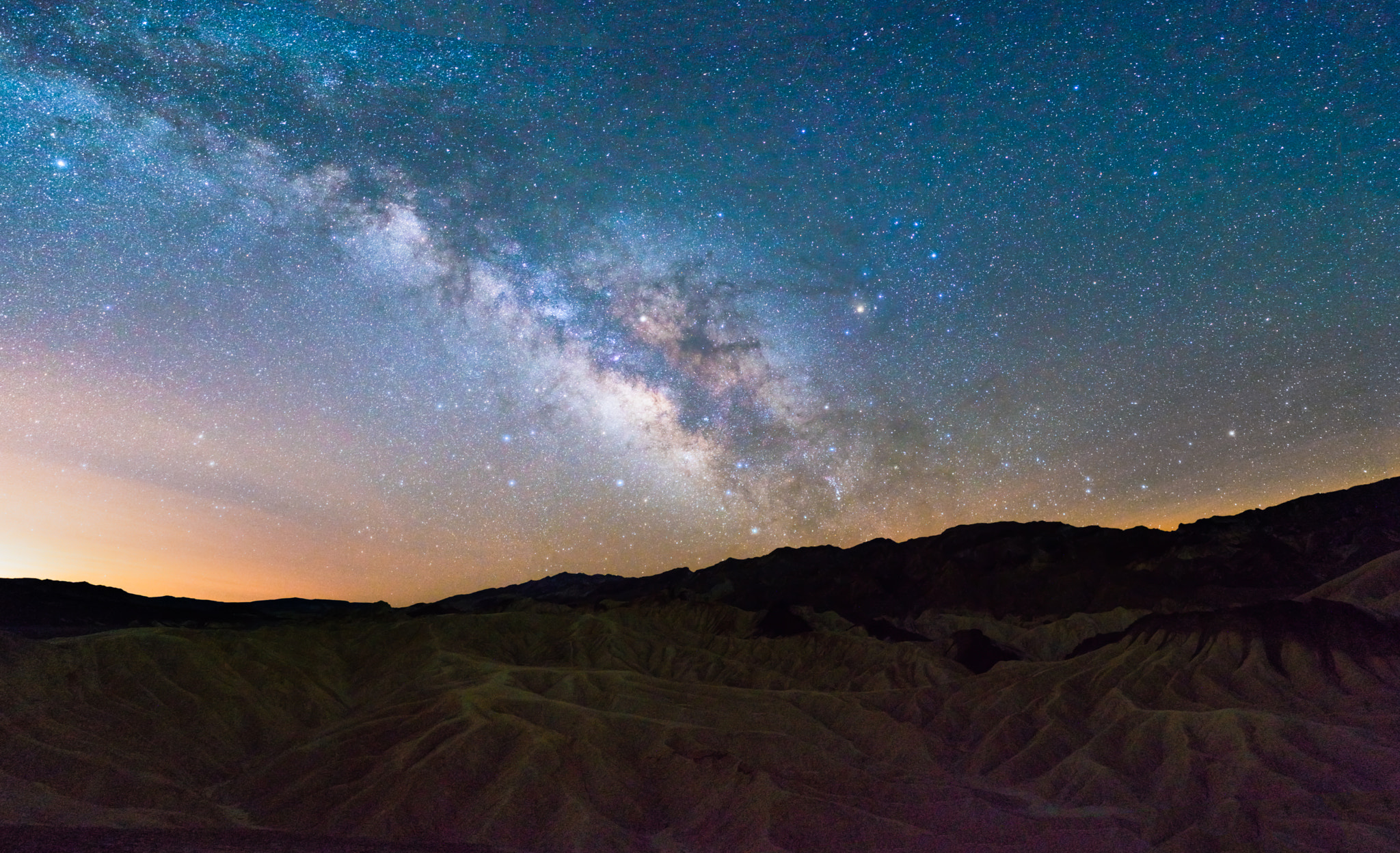 Sony FE 28mm F2 sample photo. Milky way over zabriskie point photography