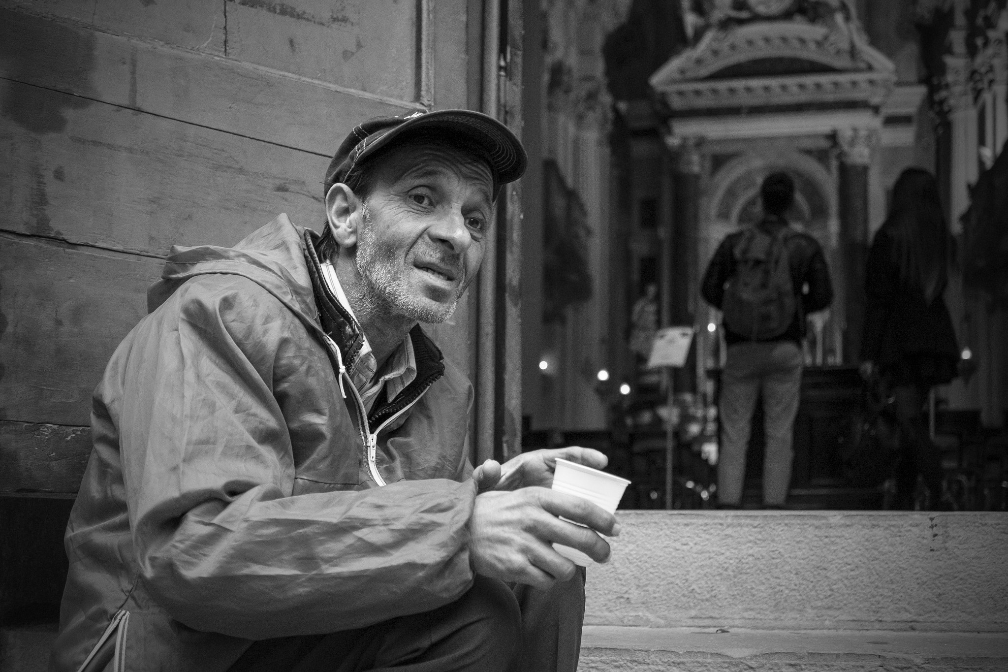 Fujifilm X-T1 + Fujifilm XF 27mm F2.8 sample photo. Begging outside a church in bologna photography